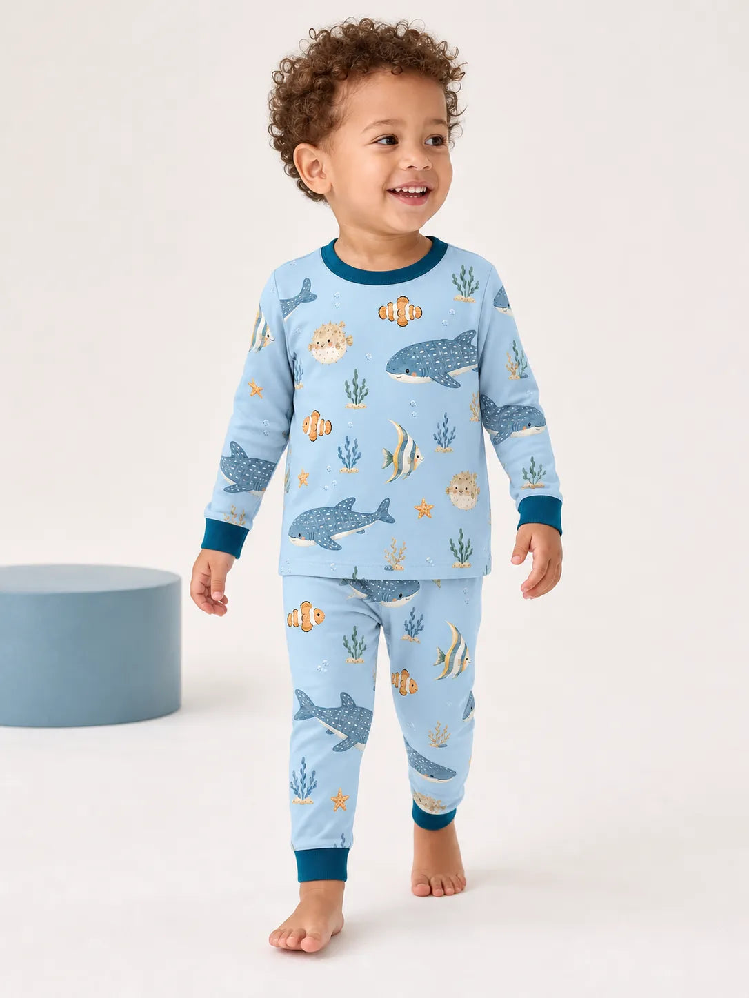 Child wearing the Shark Cove long sleeve pajama set