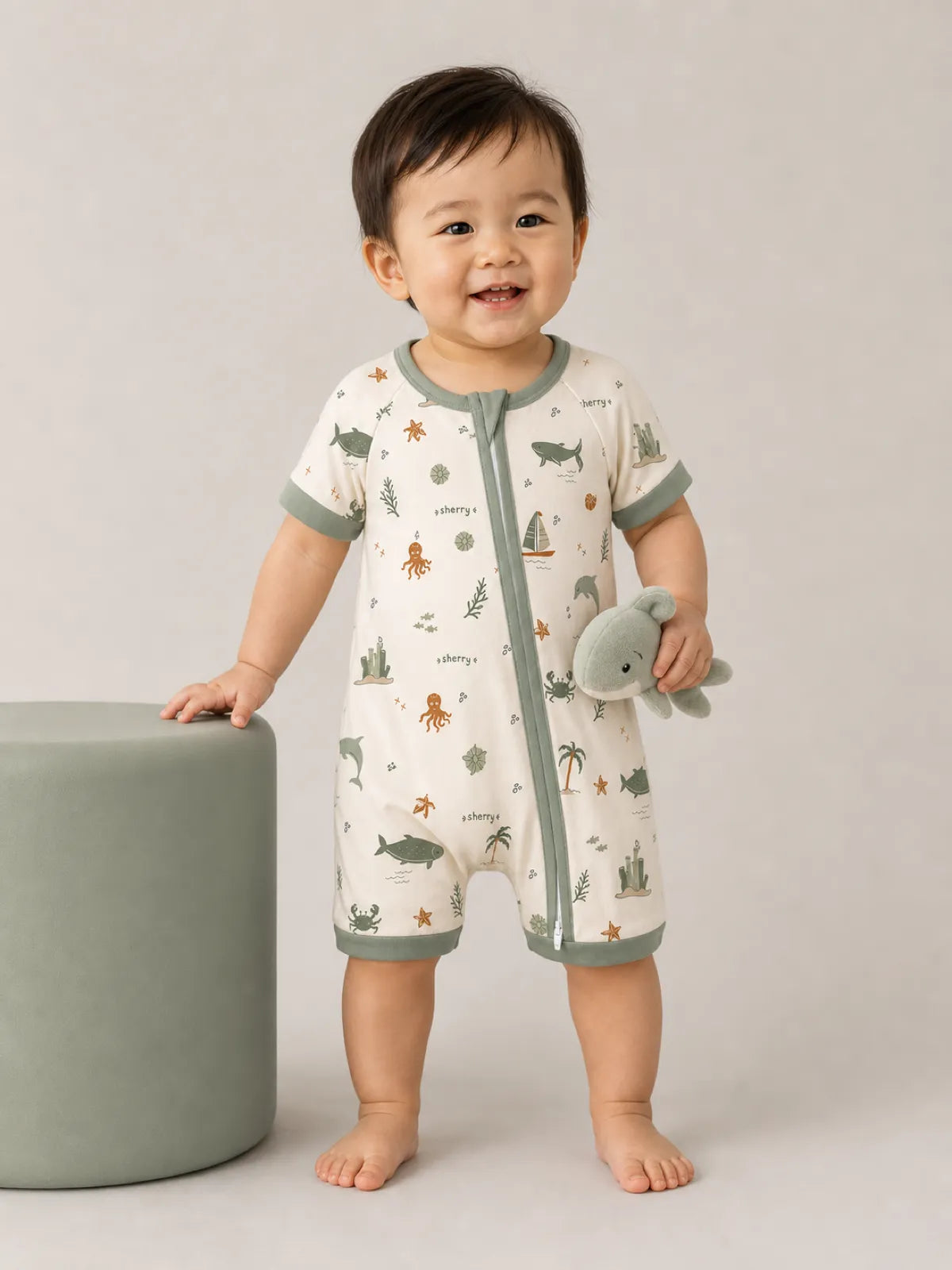 Baby wearing the Coastal Friends bamboo shorty romper