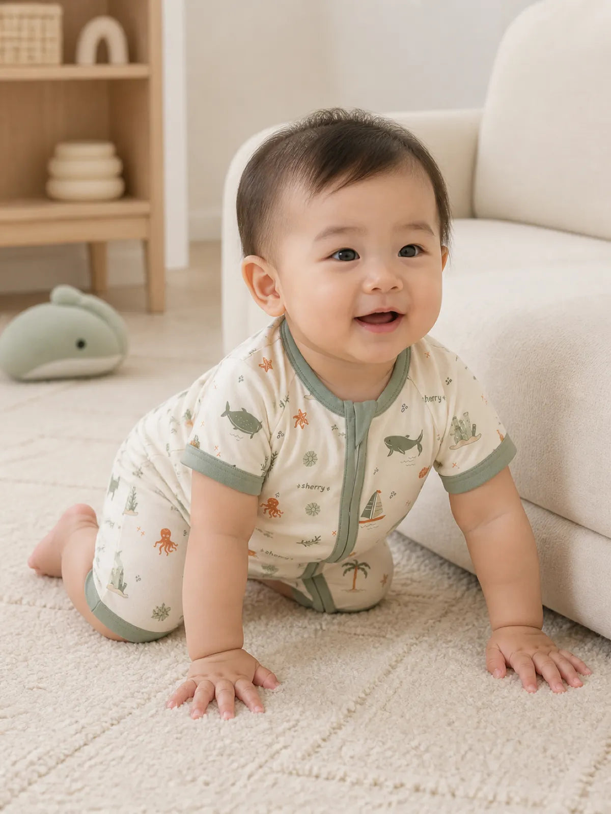 Baby playing at home in the Coastal Friends shorty romper