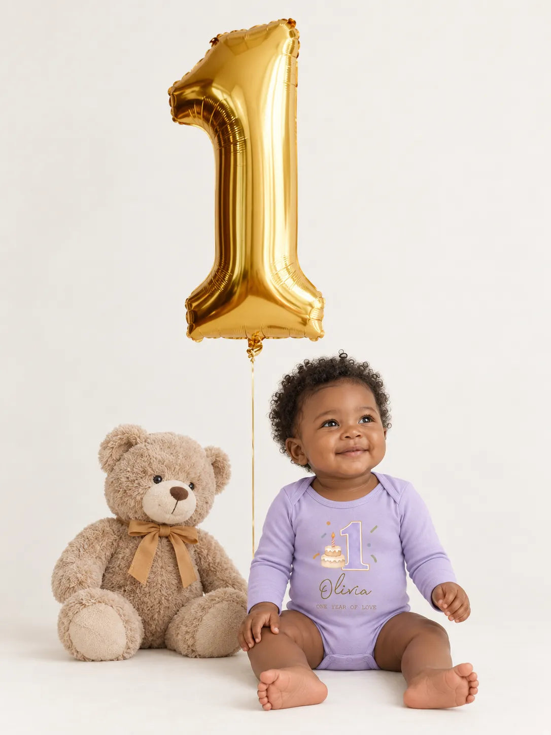 Baby wearing personalized first birthday bodysuit