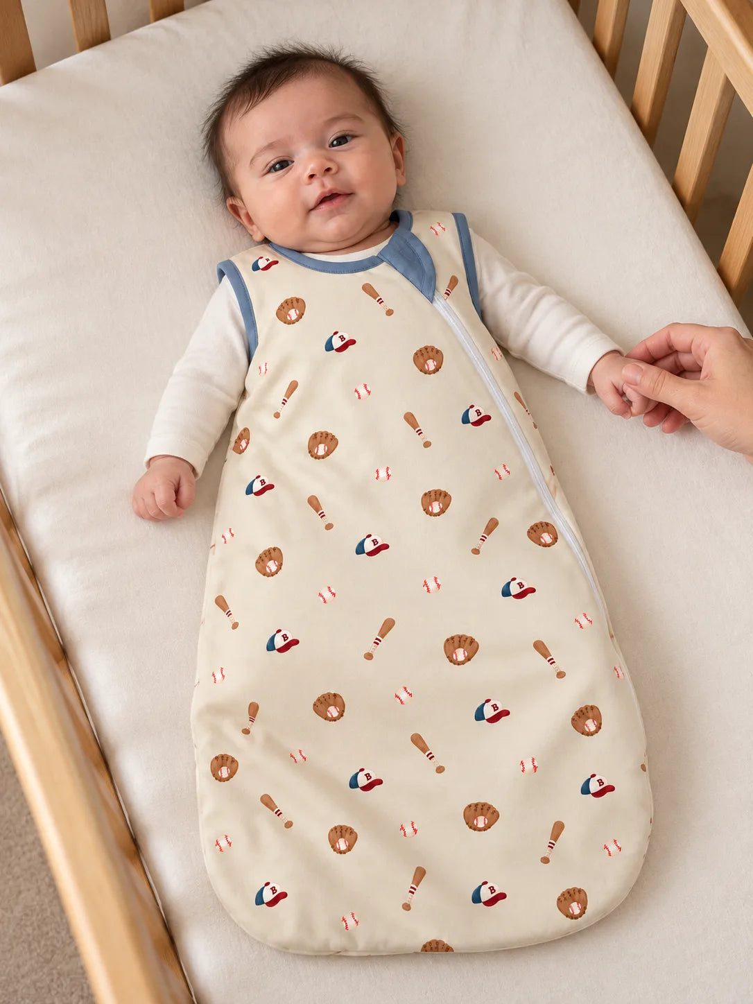 Baby resting in a cozy nursery wearing Little Sluggers oatmeal grey bamboo sleep sack