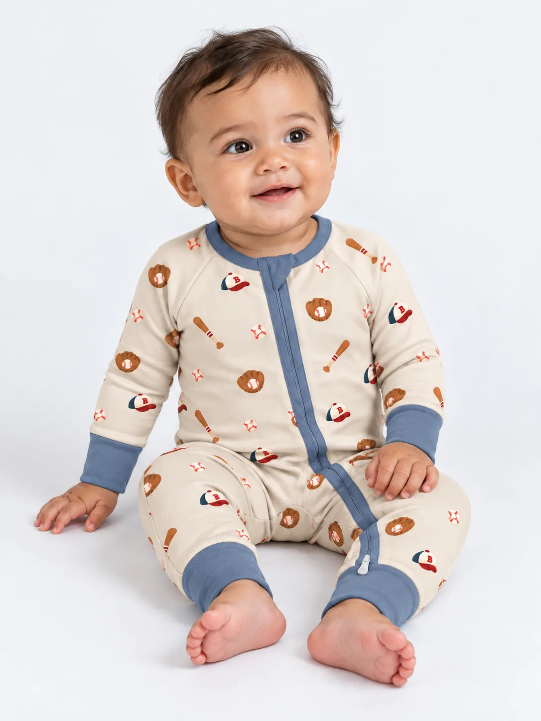 Baby wearing Little Sluggers oatmeal grey bamboo zipper romper in a studio