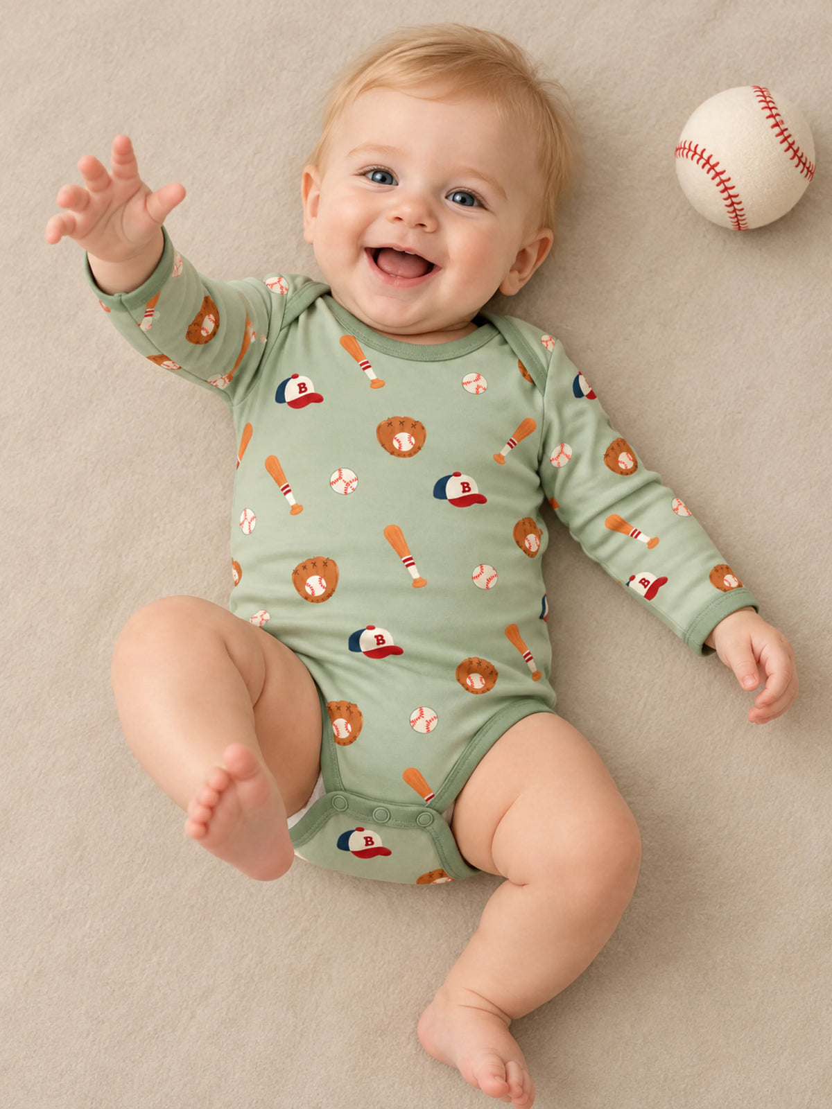 Baby wearing Little Sluggers sage green bamboo long sleeve bodysuit in a studio