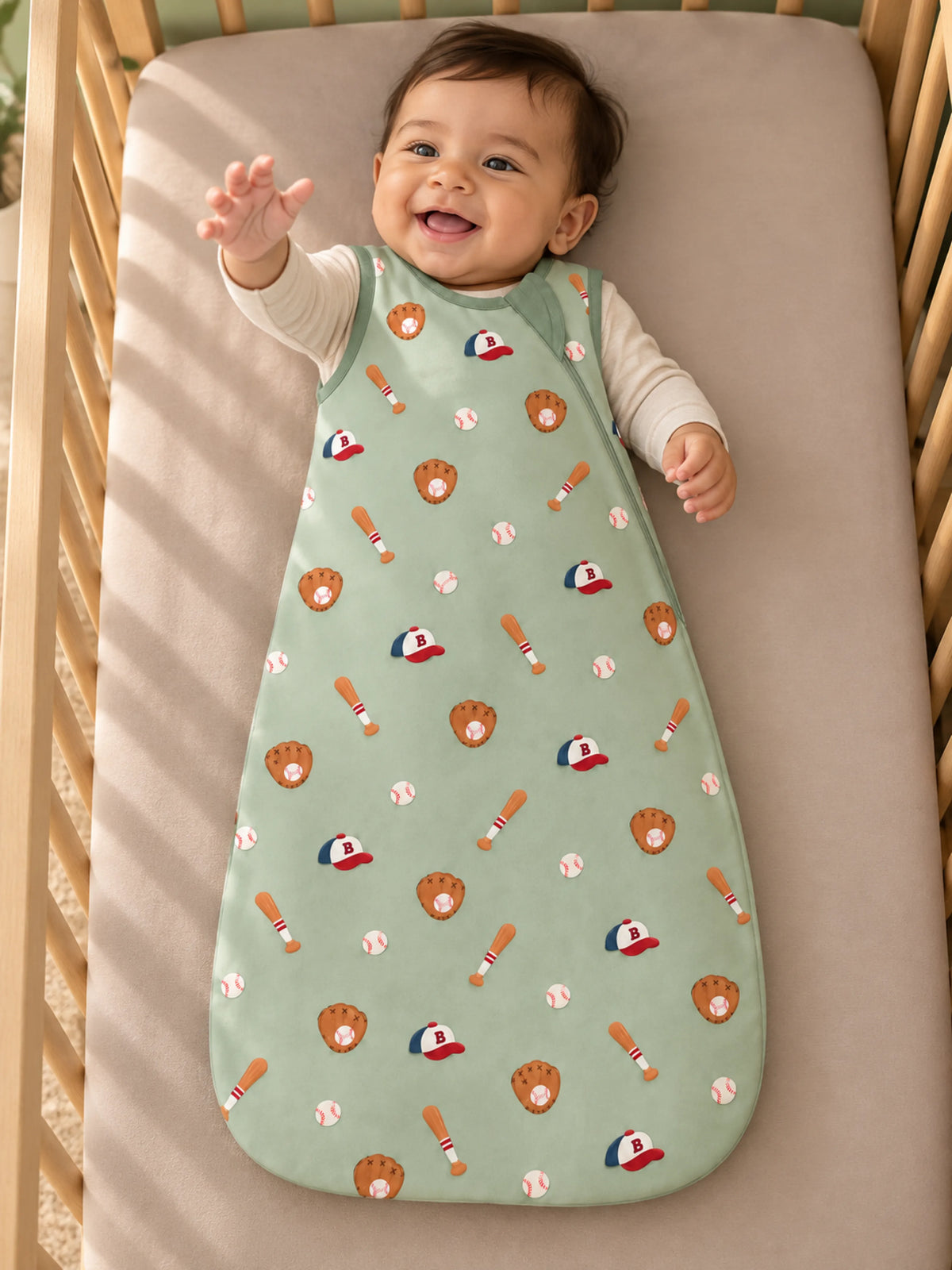 Baby resting in a cozy nursery wearing Little Sluggers sage green bamboo sleep sack