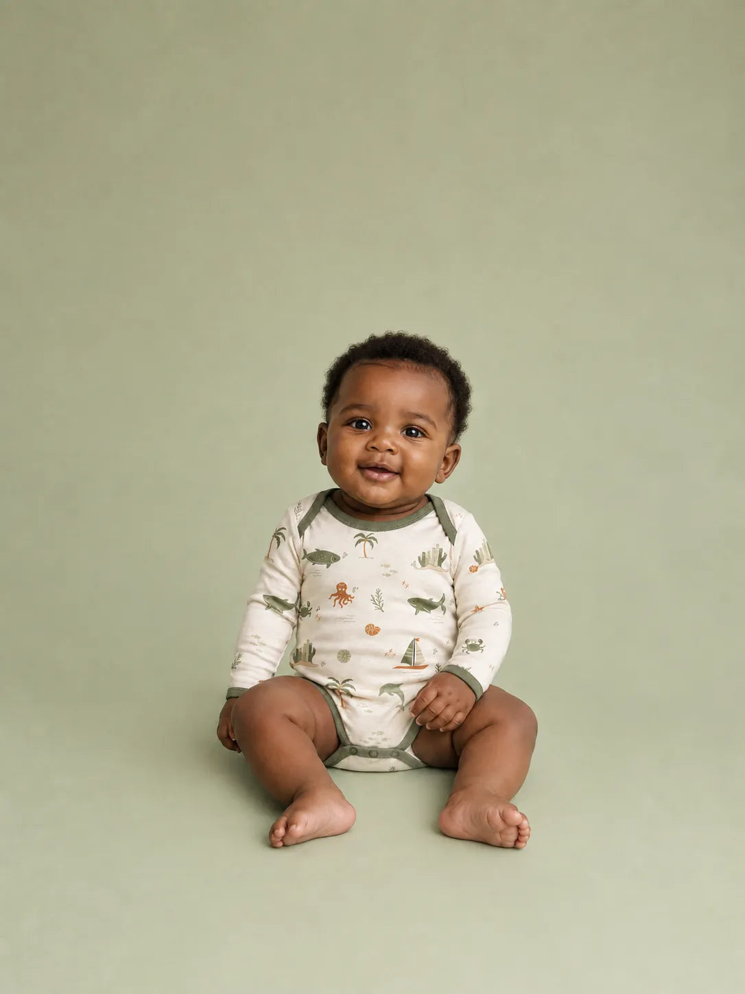 Baby wearing the Coastal Friends long sleeve bodysuit