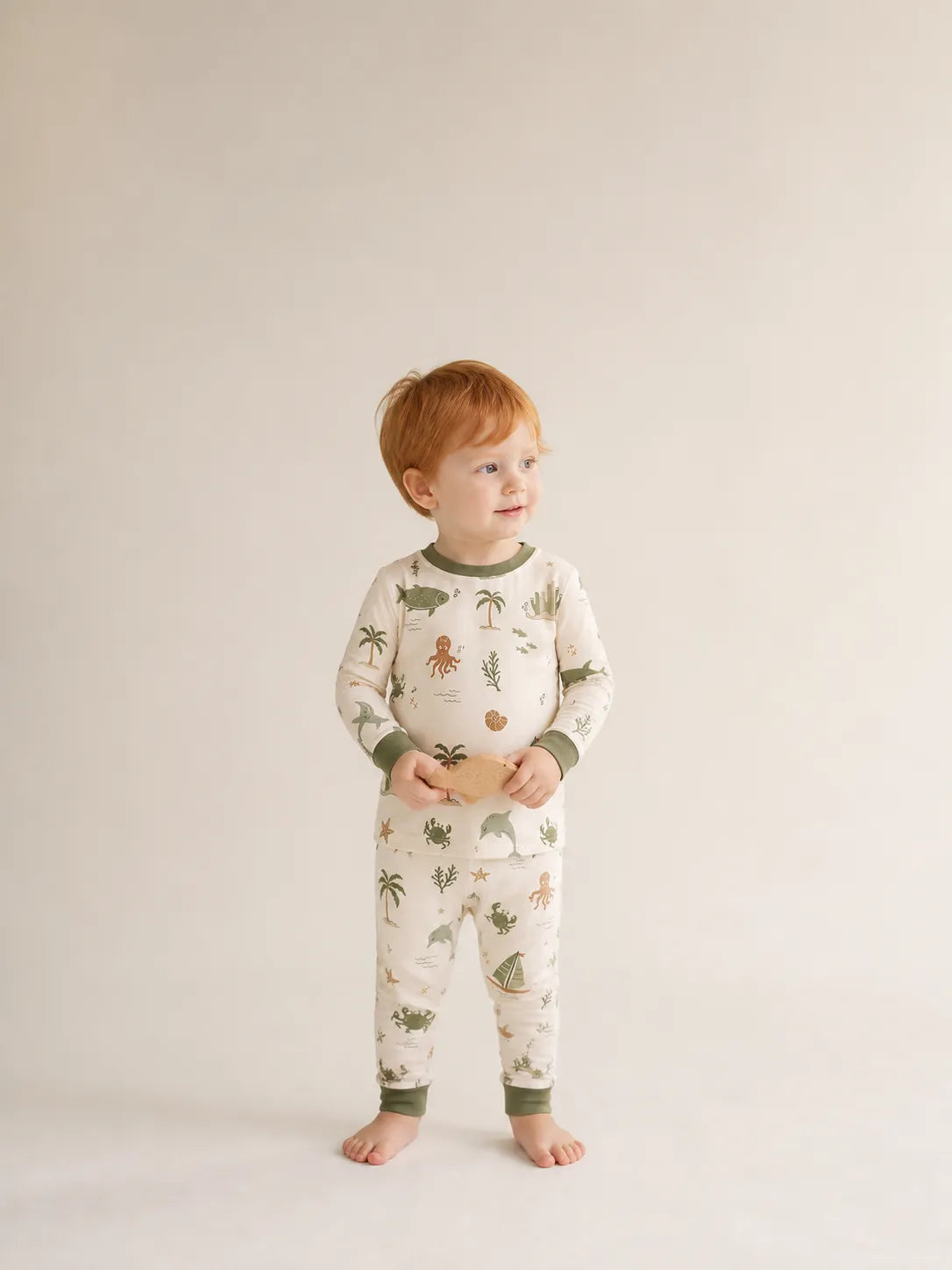 Child wearing the Coastal Friends long sleeve pajama set