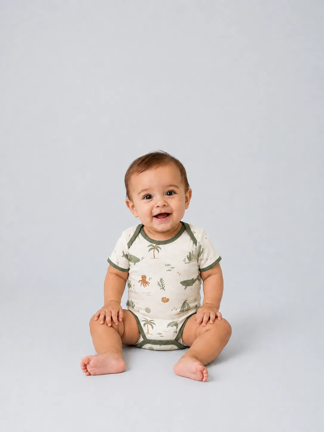 Baby wearing the Coastal Friends short sleeve bodysuit
