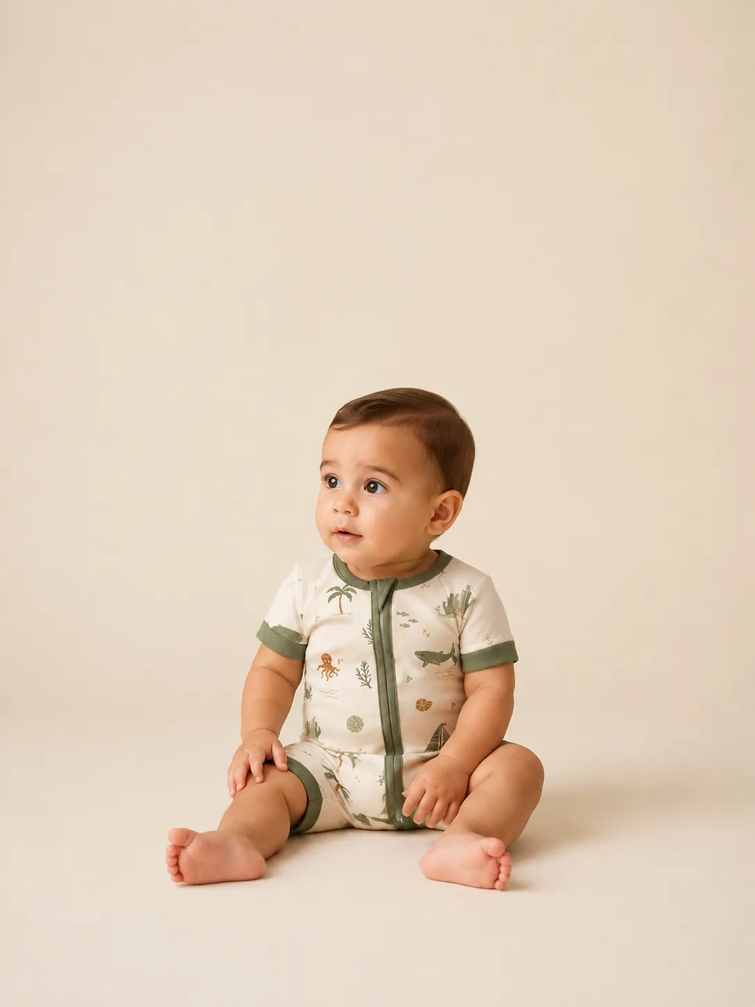 Baby wearing the Coastal Friends bamboo shorty romper