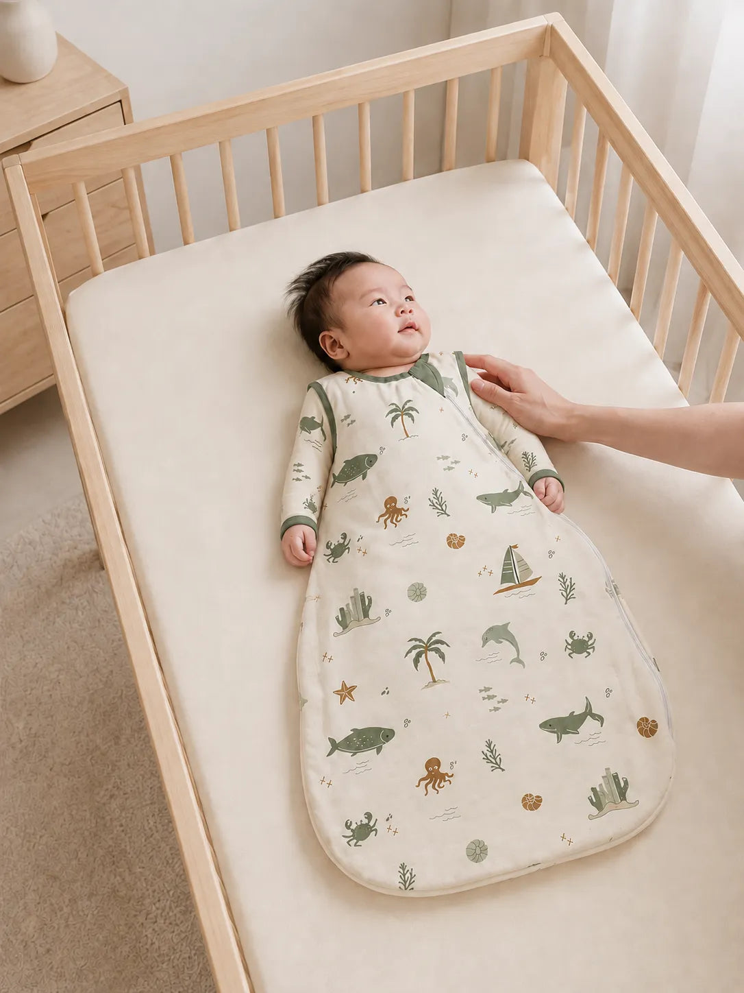 Baby resting comfortably in the Coastal Friends bamboo sleep bag
