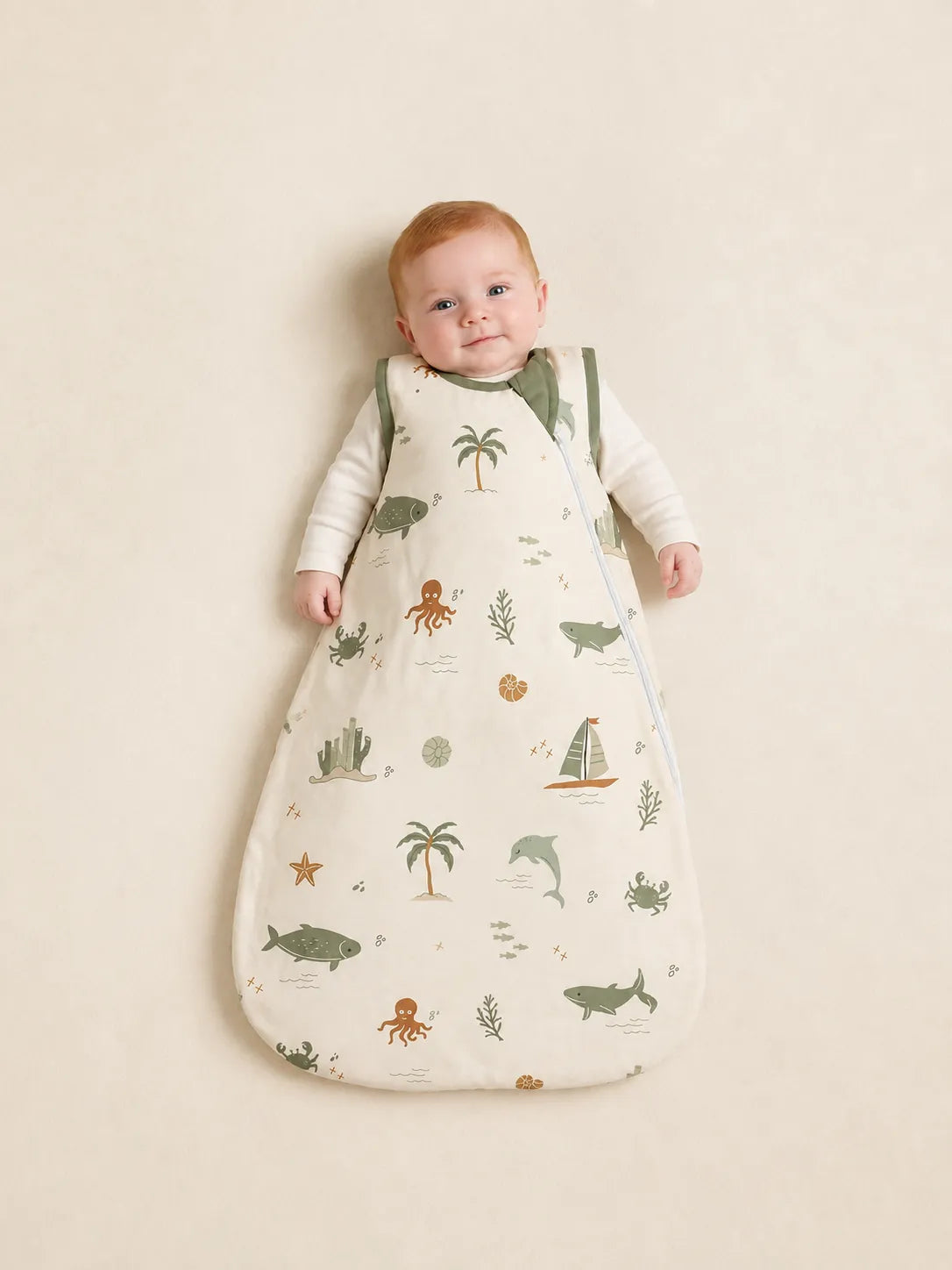 Baby wearing the Coastal Friends bamboo sleep bag