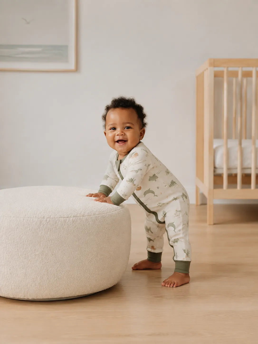 Baby playing at home in the Coastal Friends zipper romper