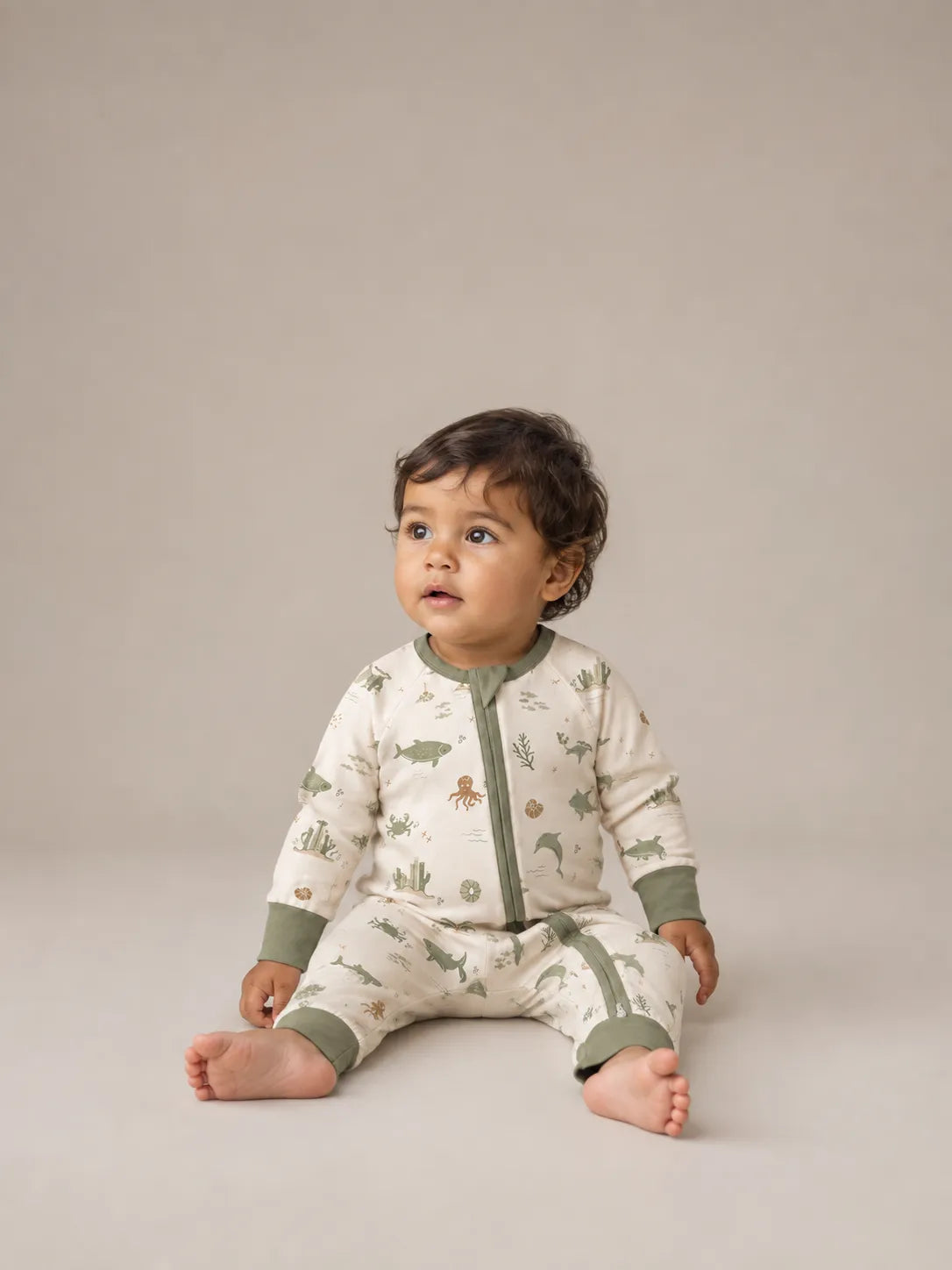 Baby wearing the Coastal Friends bamboo zipper romper
