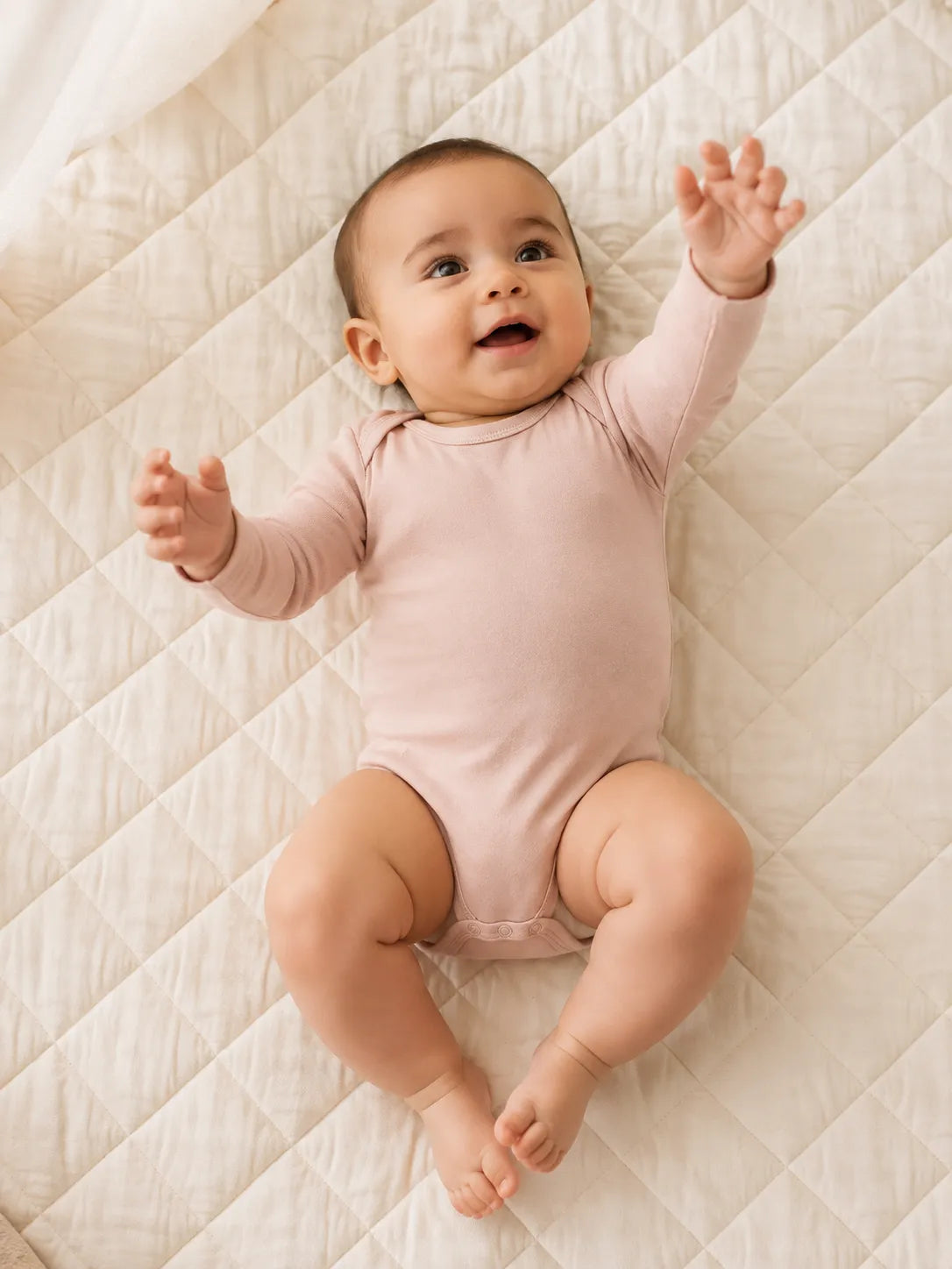 Baby in Blush Pink bamboo long sleeve bodysuit in an everyday lifestyle setting - MossiBaby