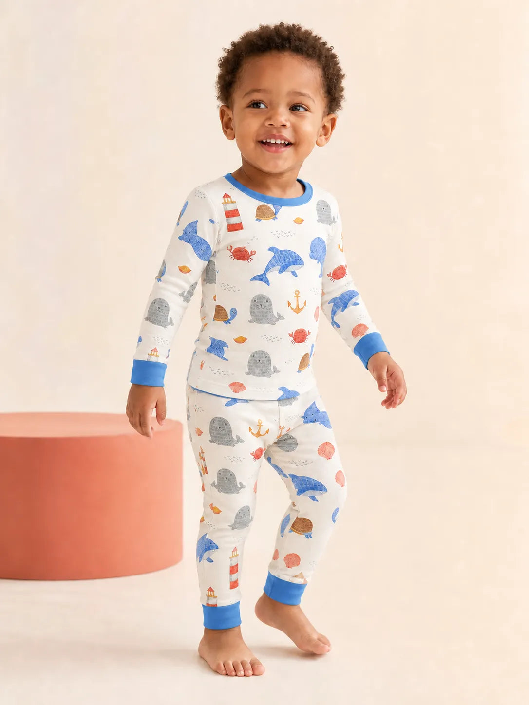 Child wearing the Whale Harbor long sleeve pajama set