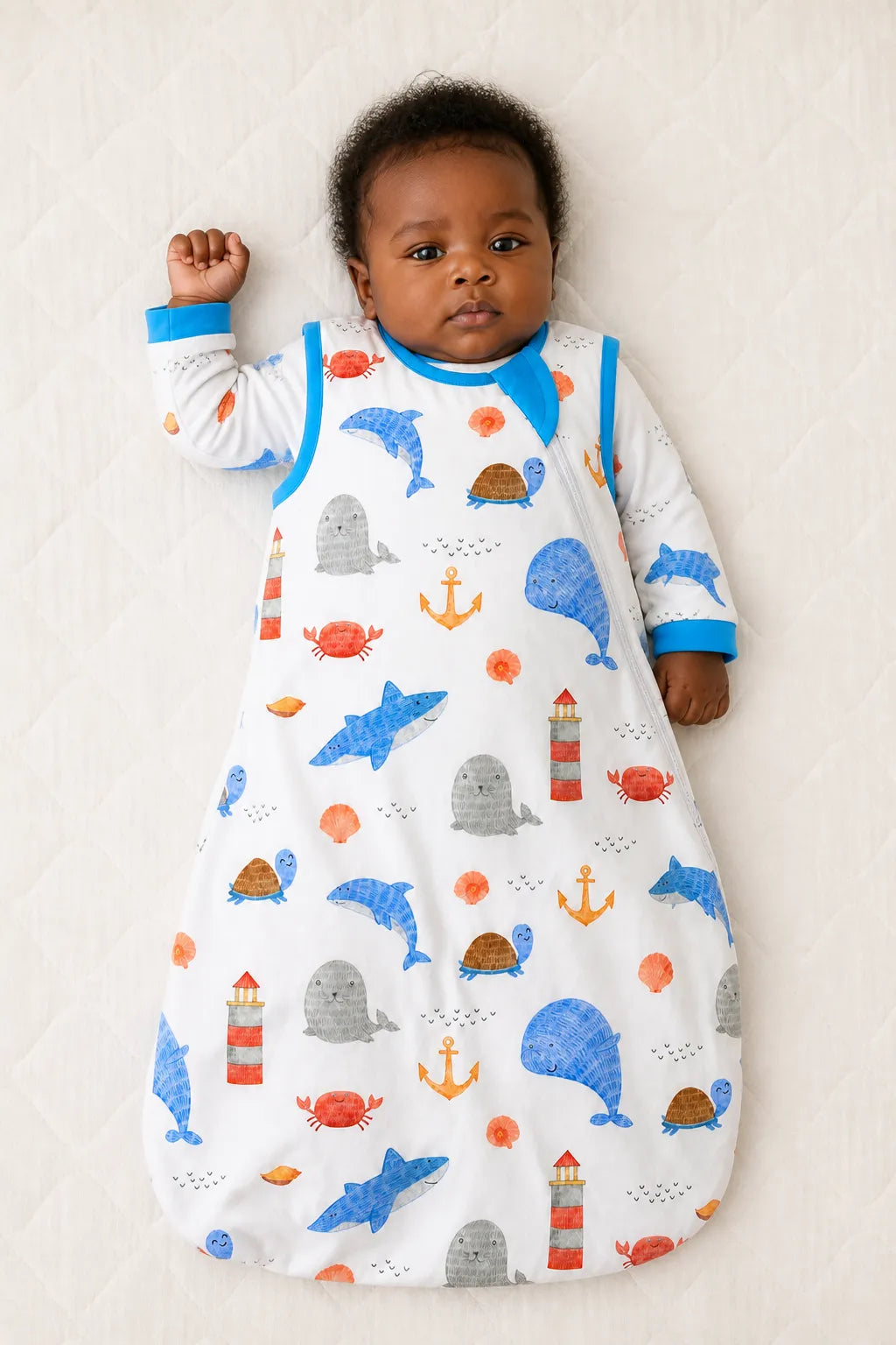 Baby wearing the Whale Harbor bamboo sleep bag