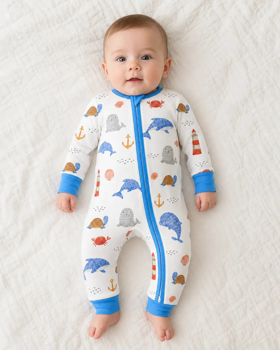 Baby wearing the Whale Harbor bamboo zipper romper