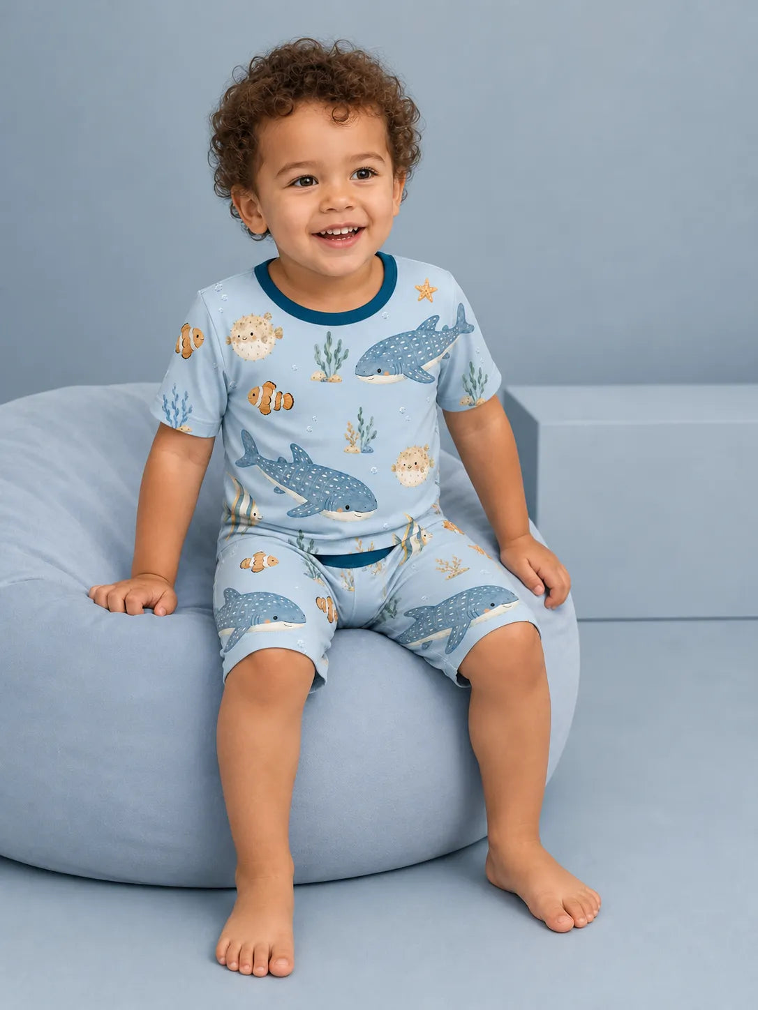 Child wearing the Shark Cove short sleeve pajama set