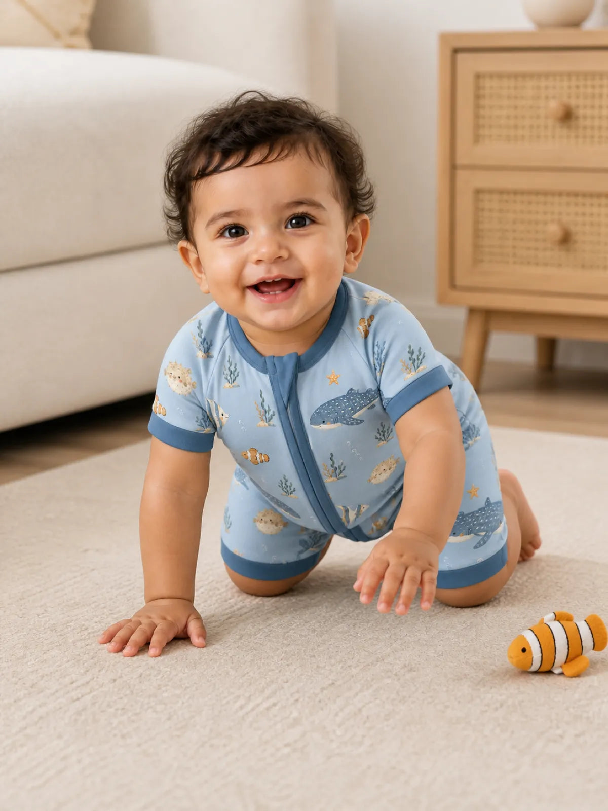 Baby playing at home in the Shark Cove shorty romper