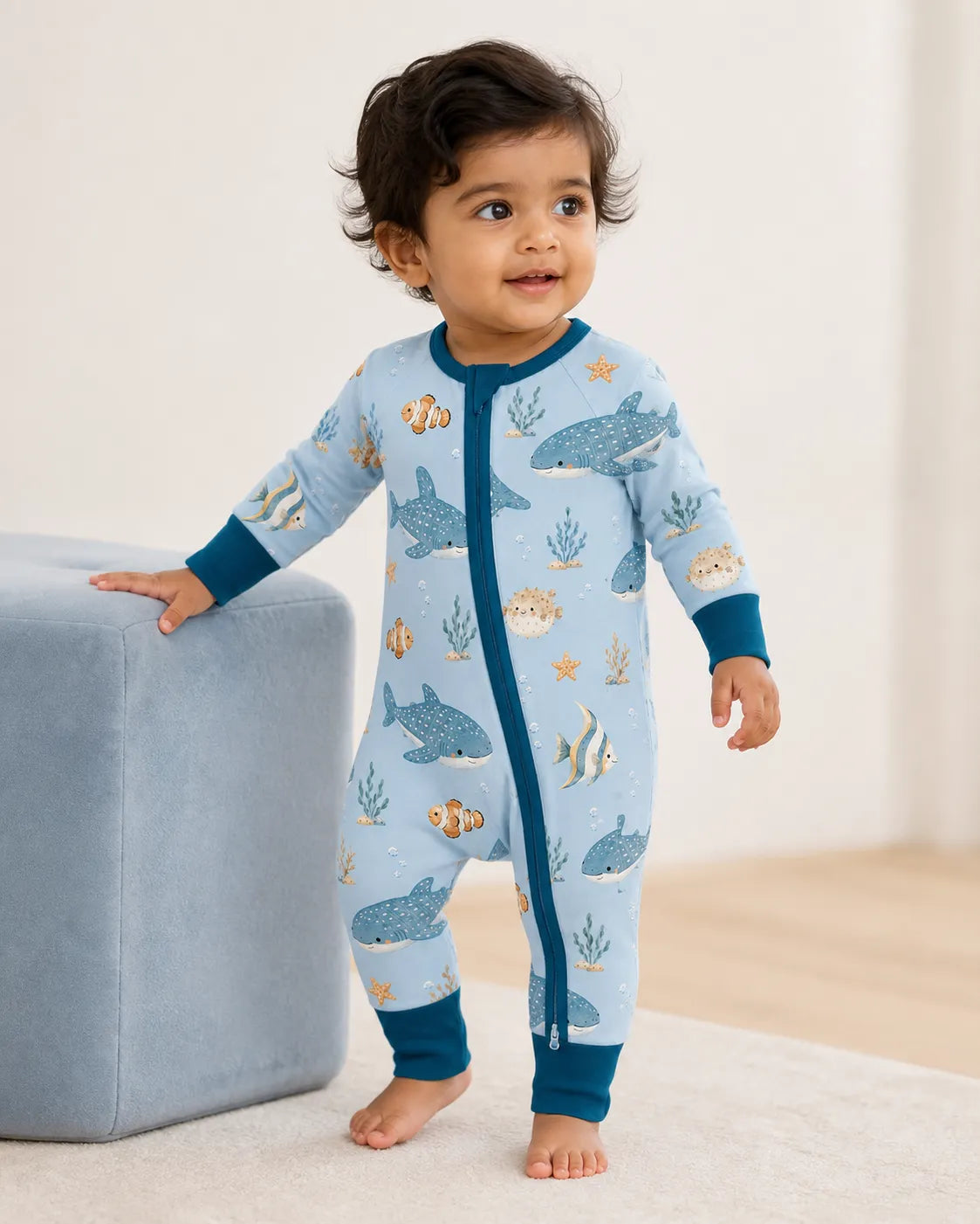 Baby wearing the Shark Cove bamboo zipper romper