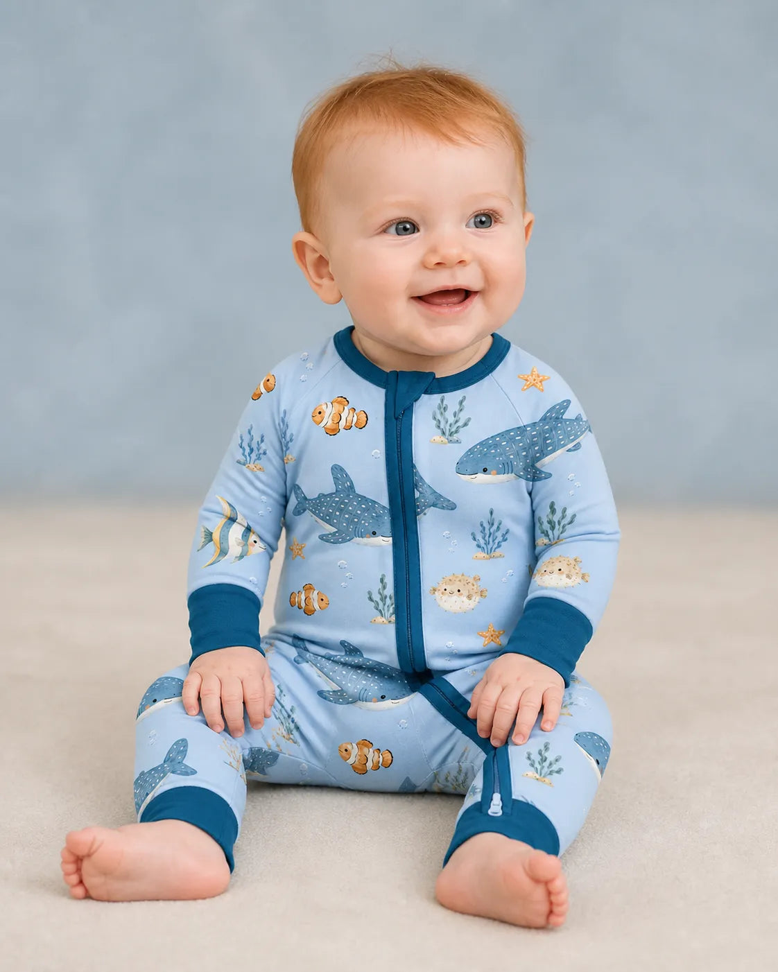 Baby playing at home in the Shark Cove zipper romper
