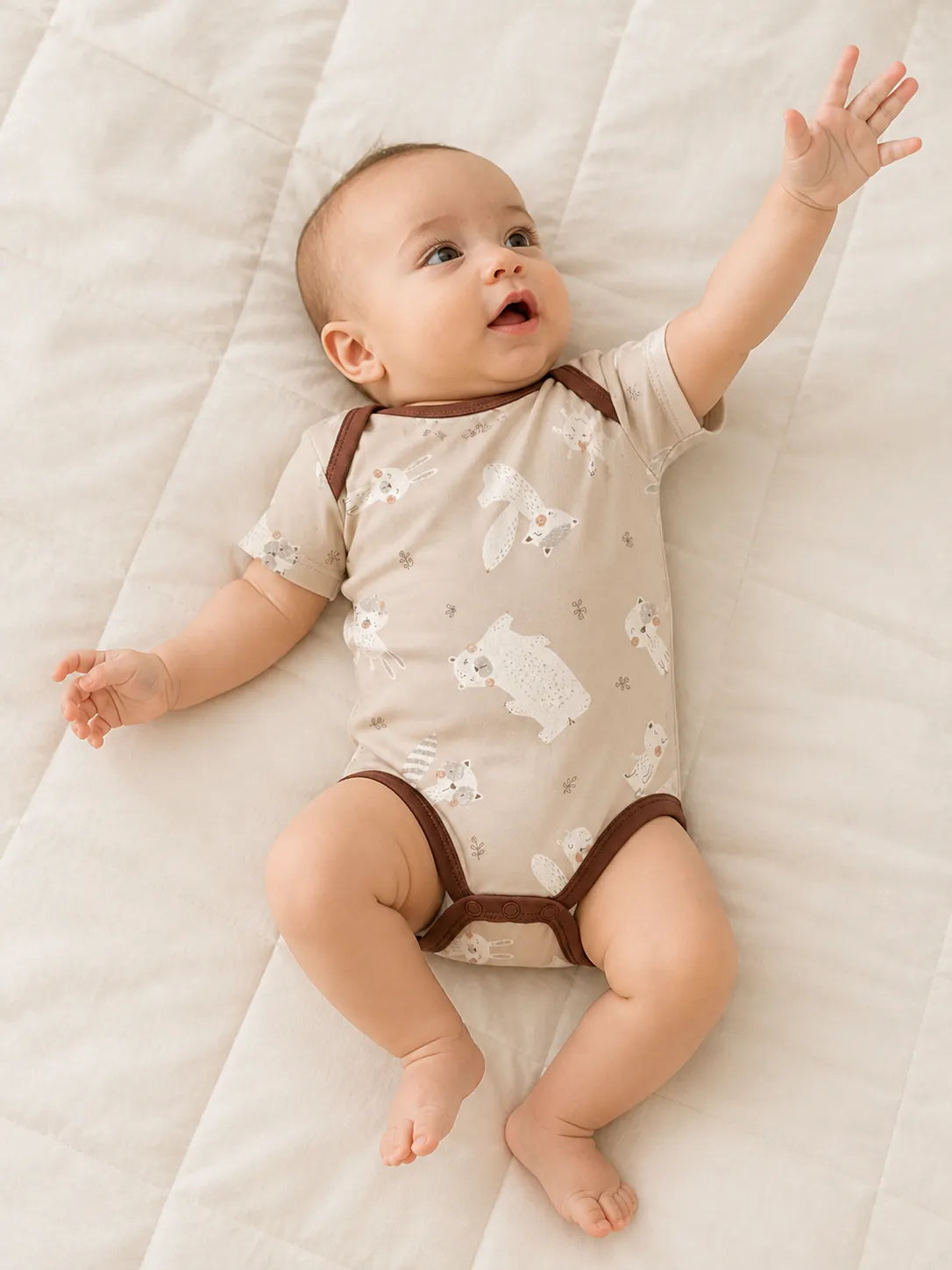 Baby playing comfortably in the Fox Meadow bamboo bodysuit