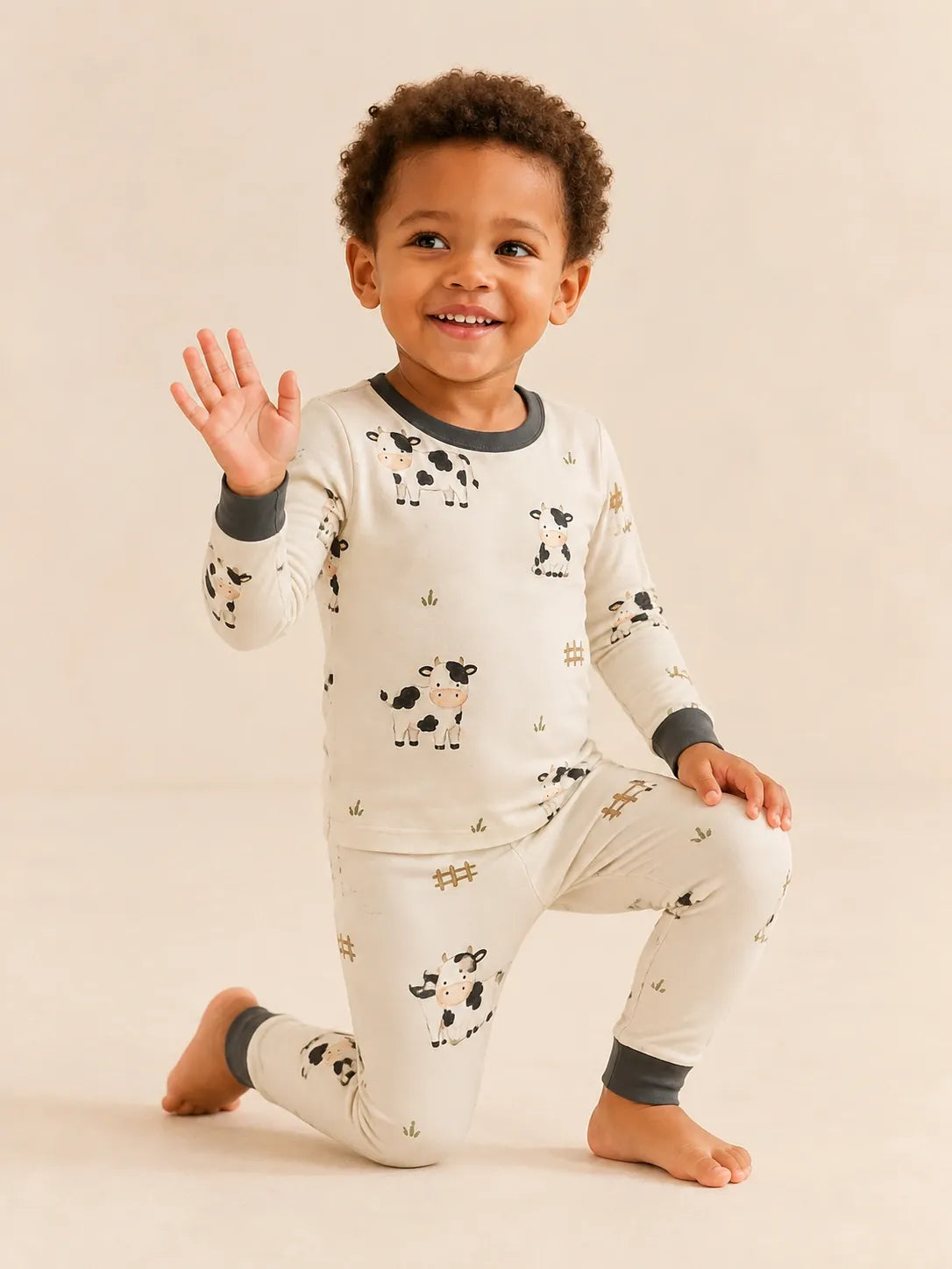 Child wearing the Little Moo long sleeve pajama set