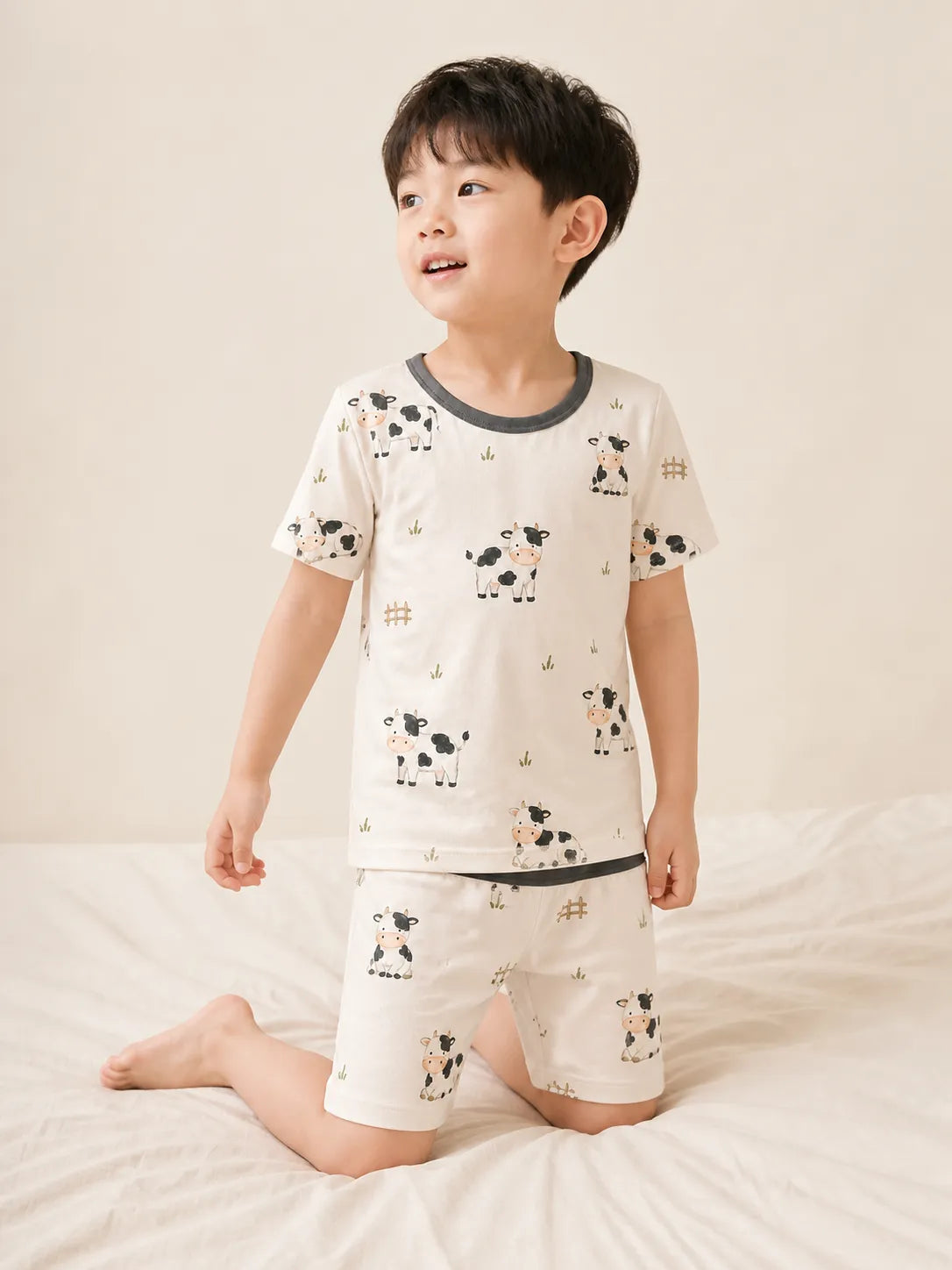 Child playing at home in Little Moo bamboo pajamas