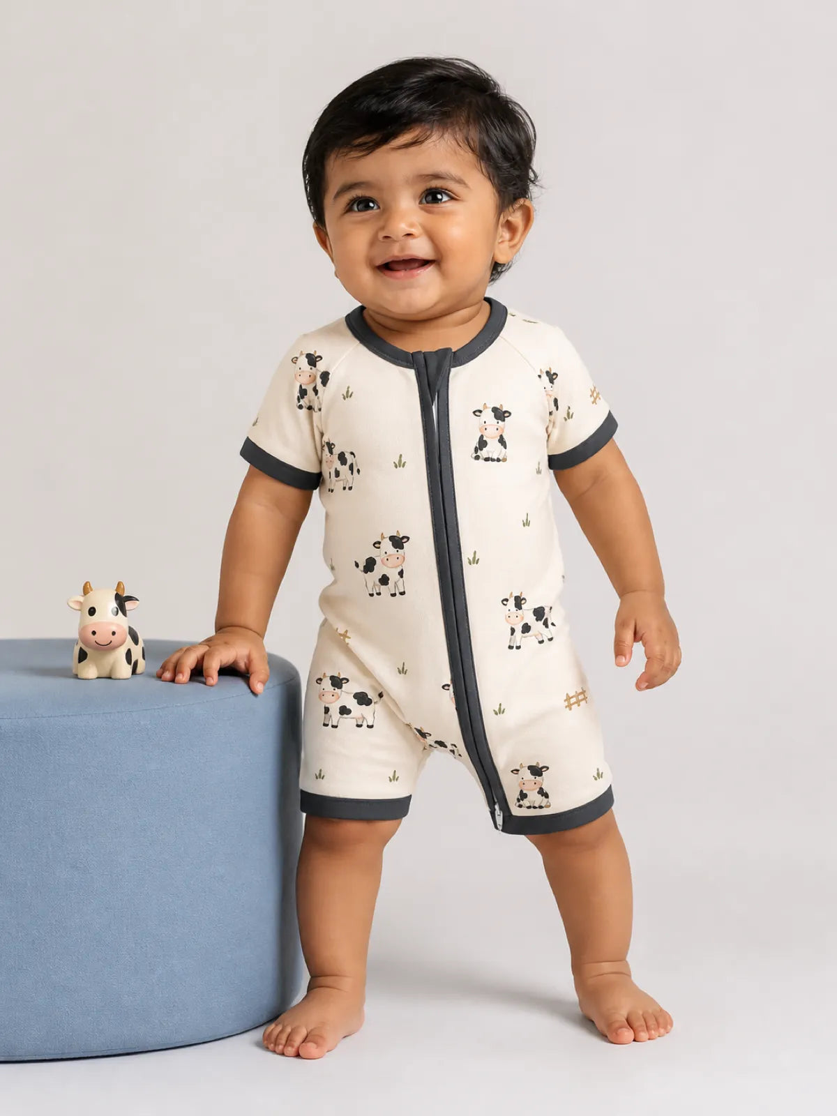 Baby wearing the Little Moo bamboo shorty romper