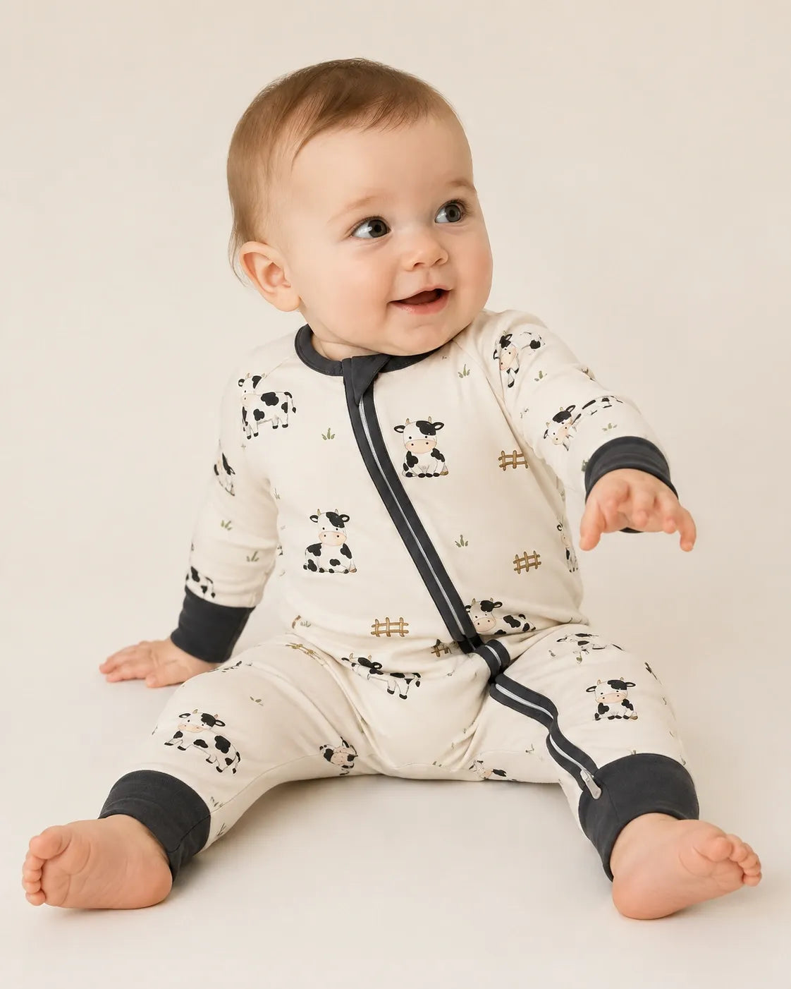 Baby wearing the Little Moo bamboo zipper romper