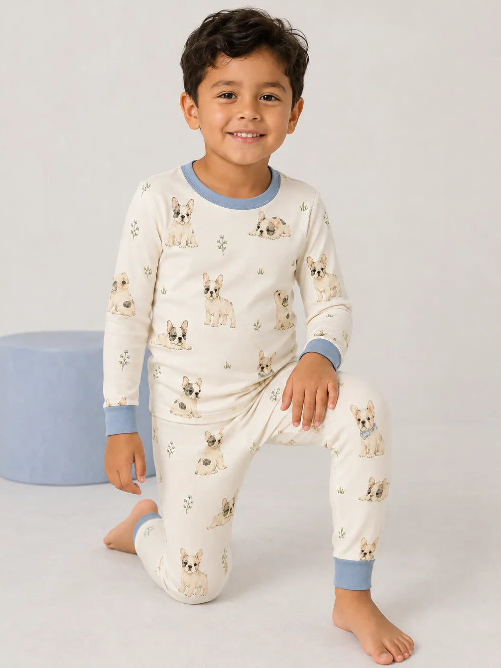 Child playing at home in Frenchie Friends bamboo pajamas