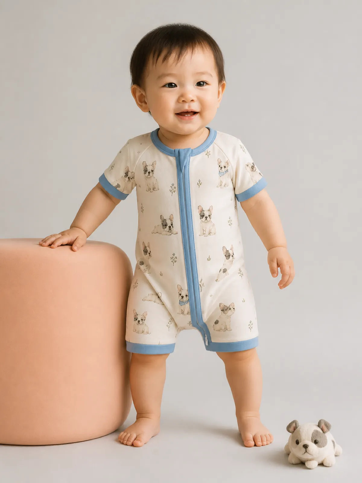Baby wearing the Frenchie Friends bamboo shorty romper