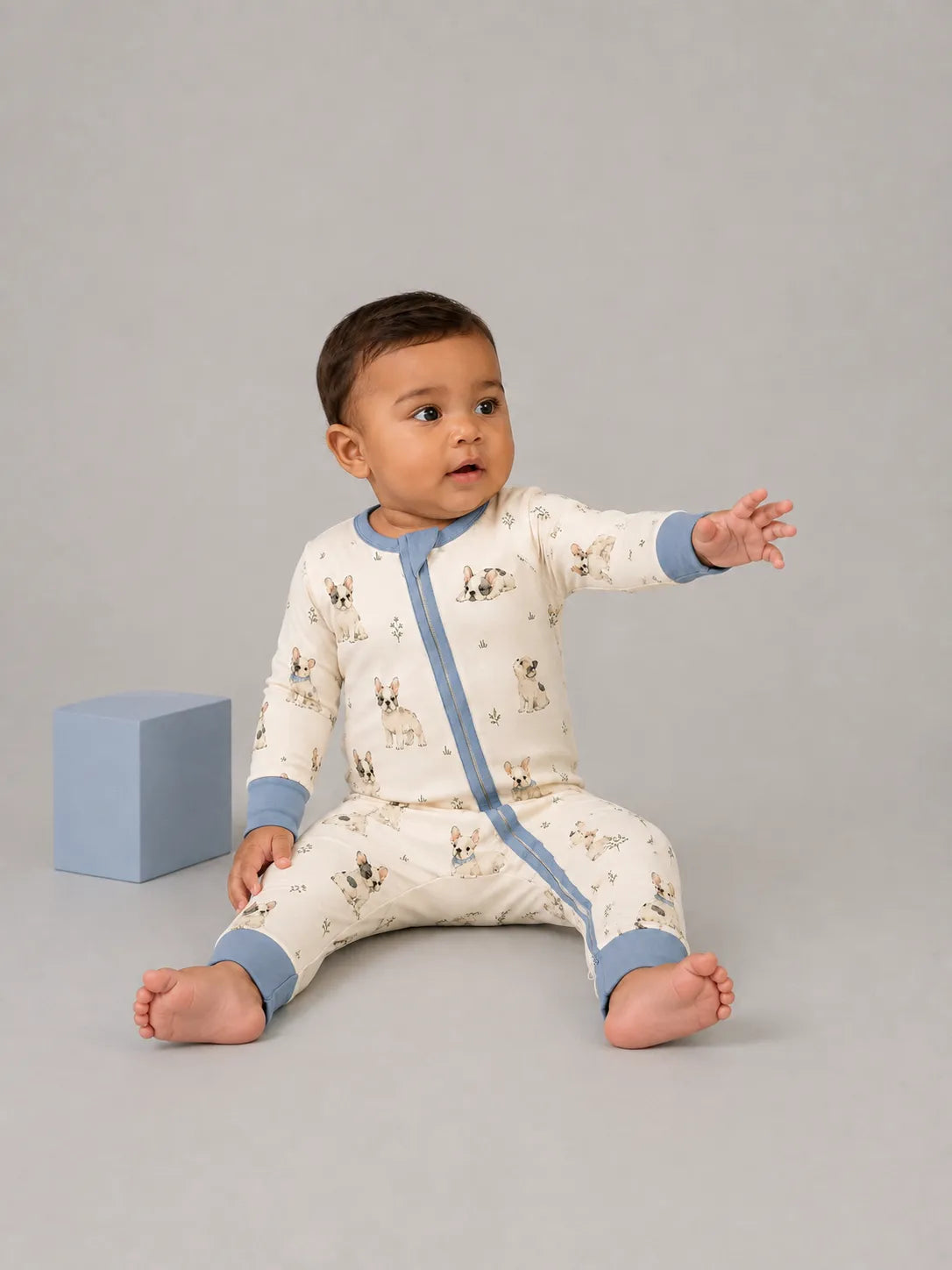 Baby wearing the Frenchie Friends bamboo zipper romper