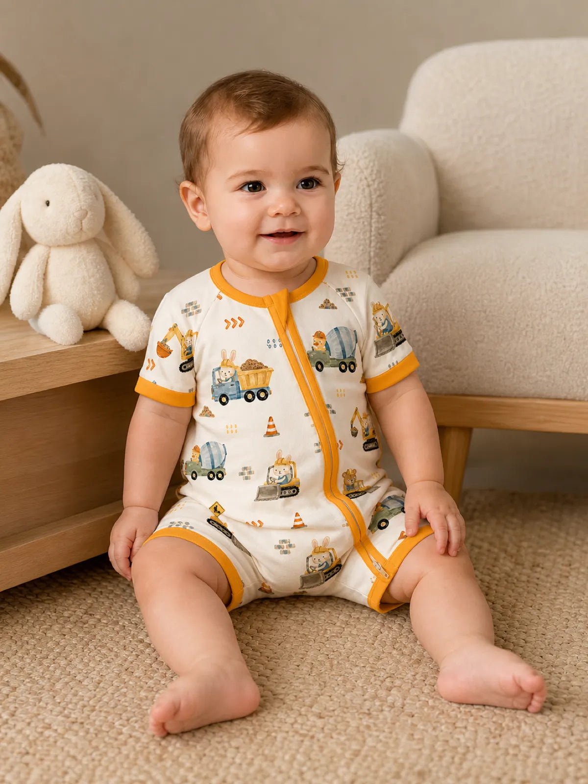 Baby playing at home in the Construction Crew shorty romper