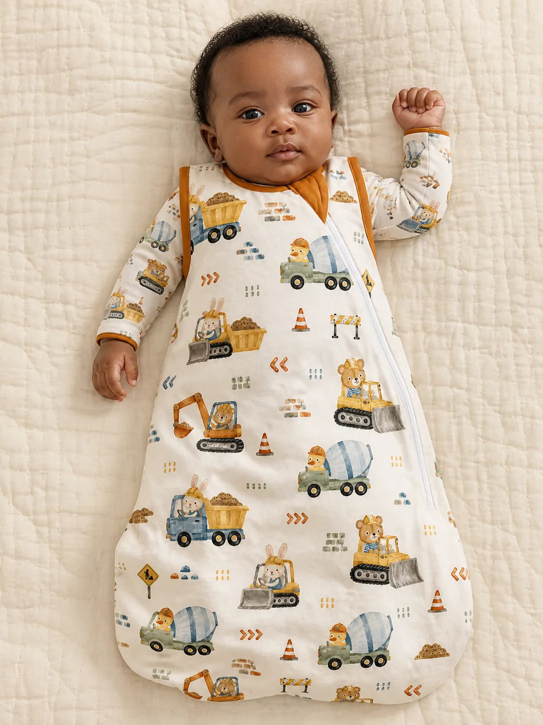 Baby resting comfortably in the Construction Crew bamboo sleep bag