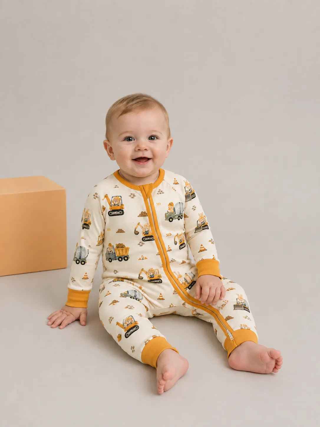 Baby wearing the Construction Crew bamboo zipper romper