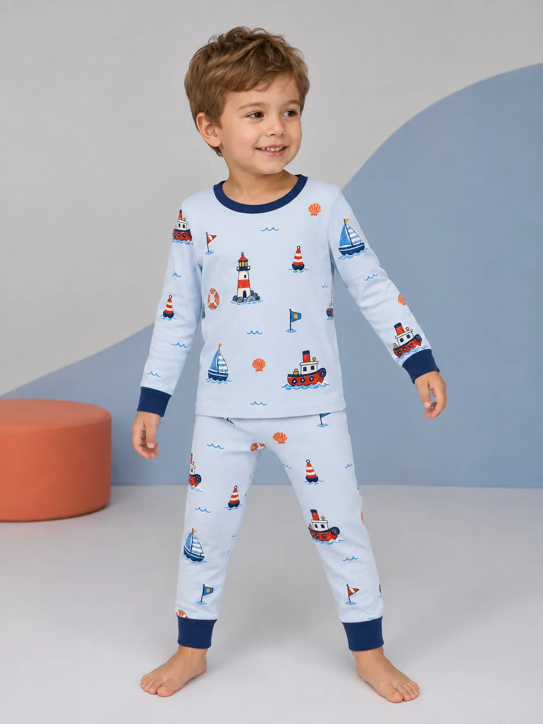 Child wearing the Sail Away long sleeve pajama set