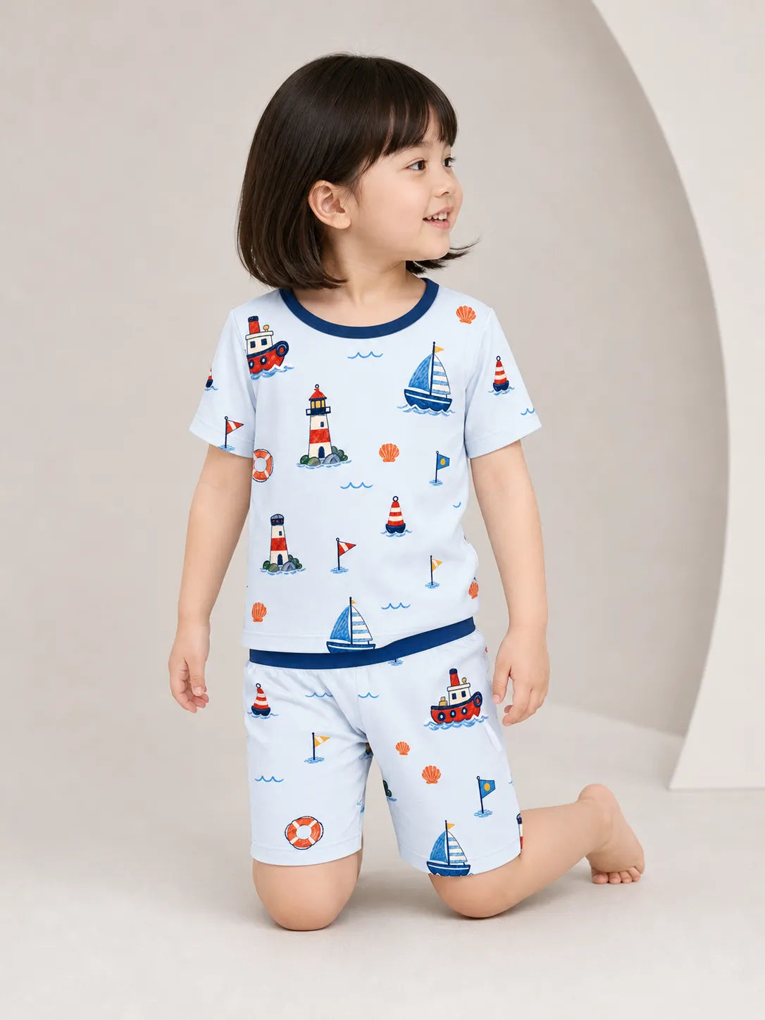 Child wearing the Sail Away short sleeve pajama set