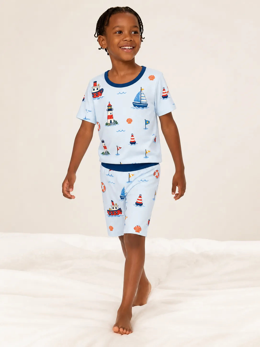 Child playing at home in Sail Away bamboo pajamas