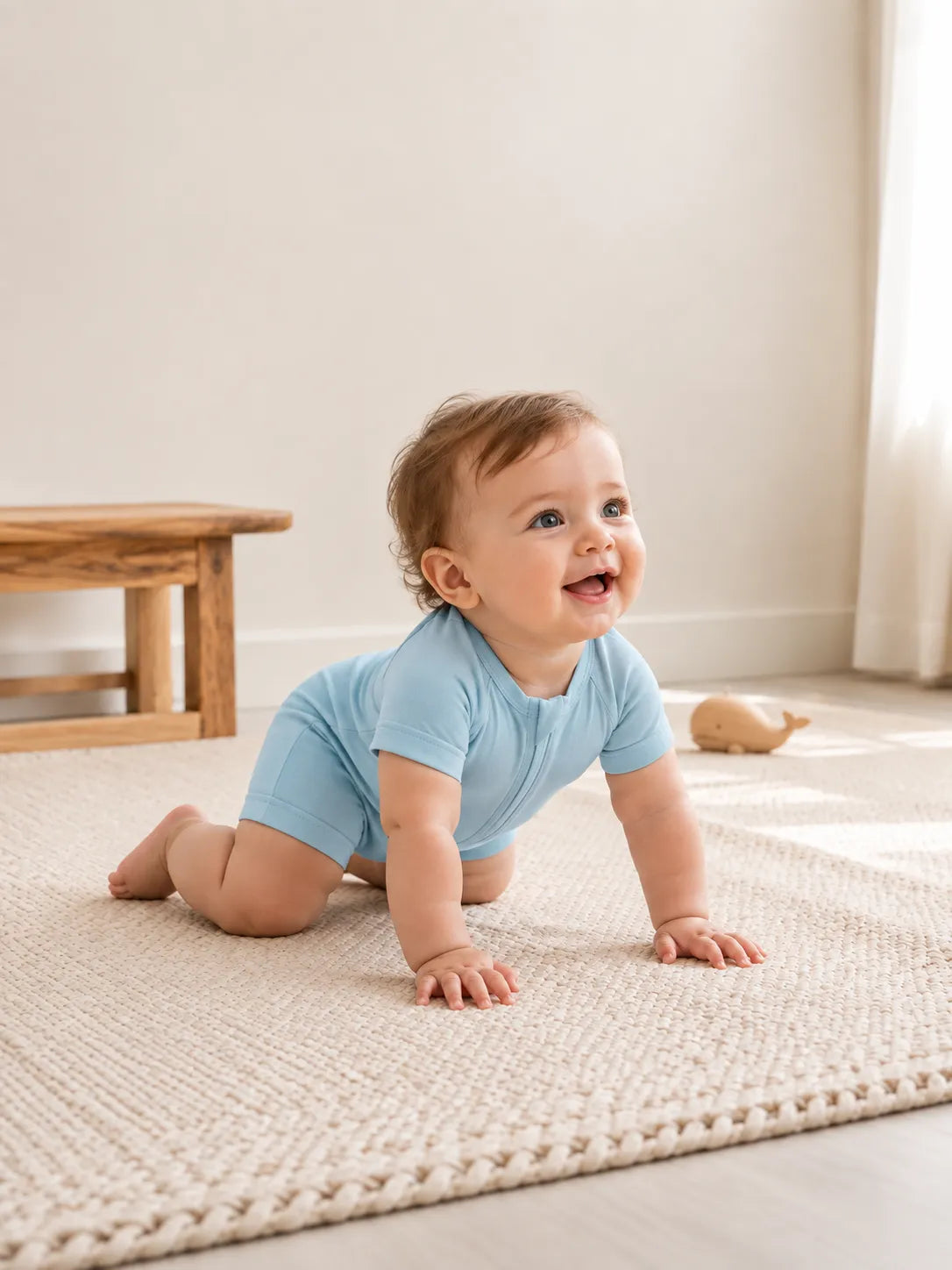Baby in Dusty Blue bamboo shorty romper in an everyday lifestyle setting - MossiBaby
