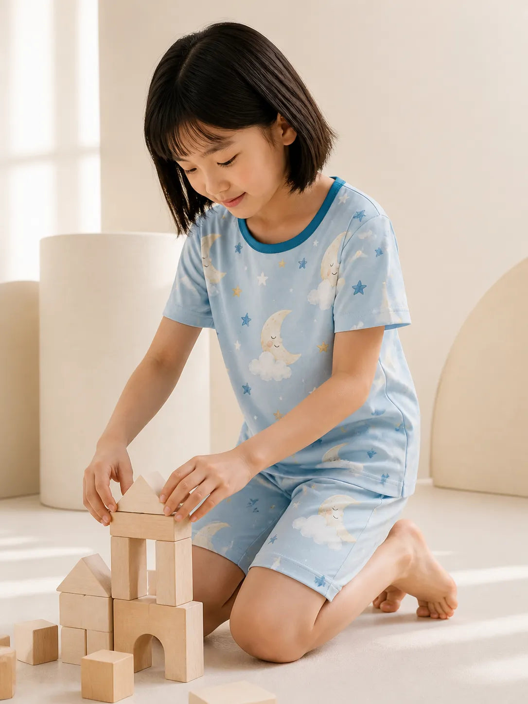 Child wearing the Moonlit Dreams short sleeve pajama set
