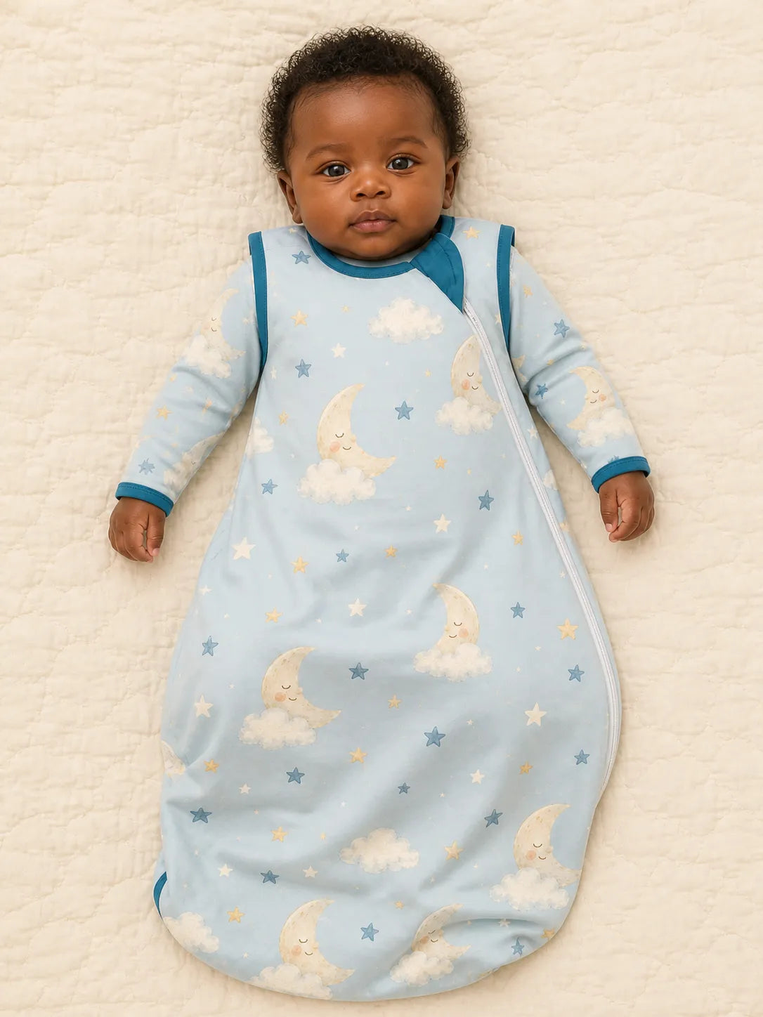 Baby resting comfortably in the Moonlit Dreams bamboo sleep bag