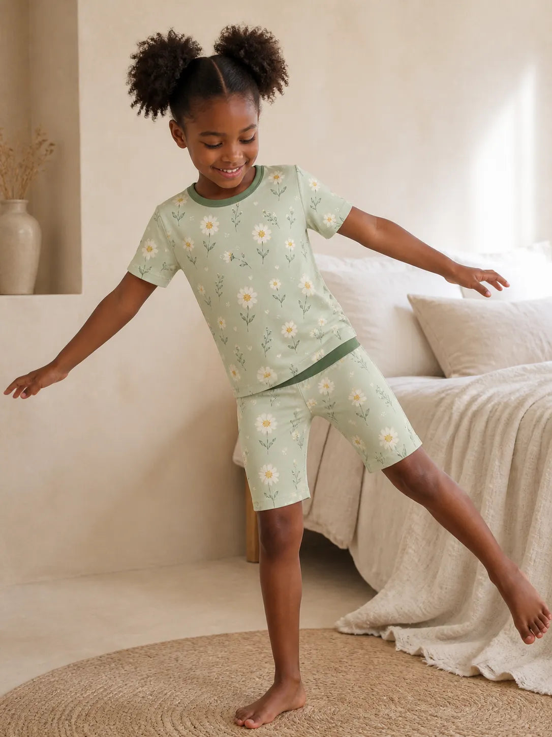 Child playing at home in Daisy Meadow bamboo pajamas