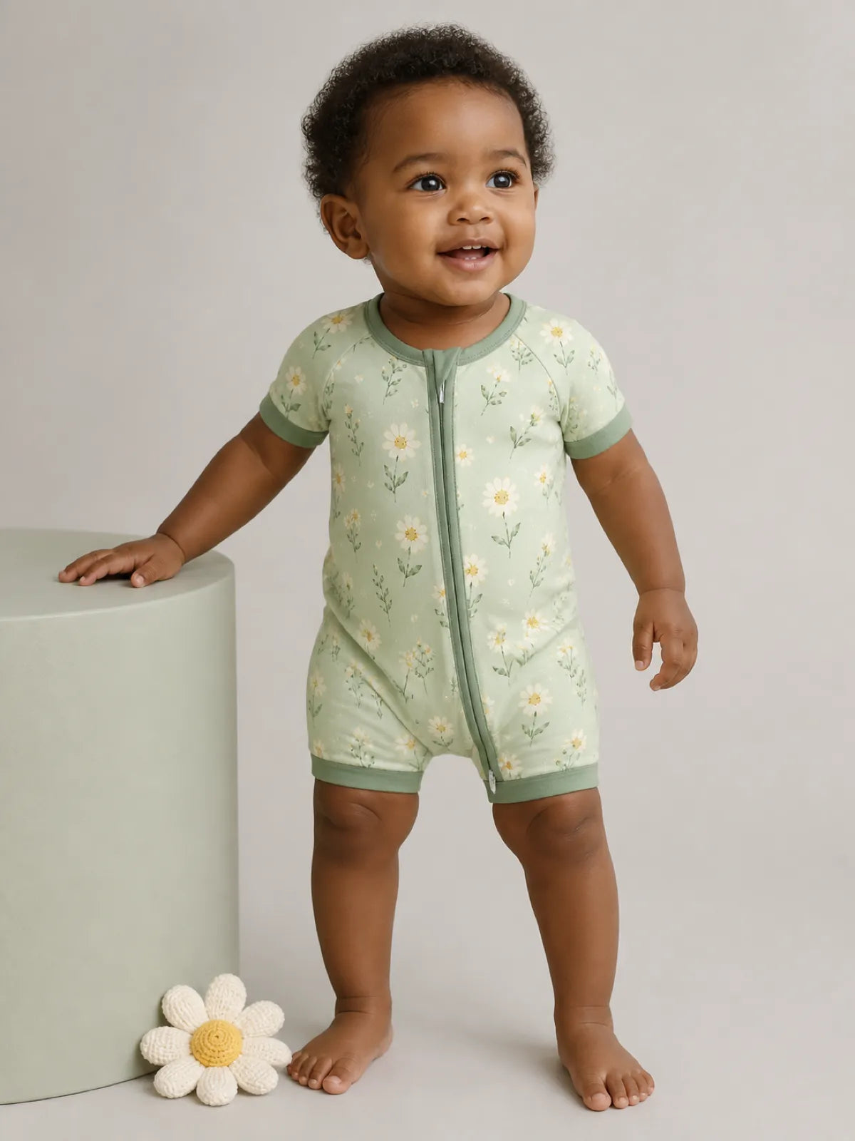 Baby wearing the Daisy Meadow bamboo shorty romper