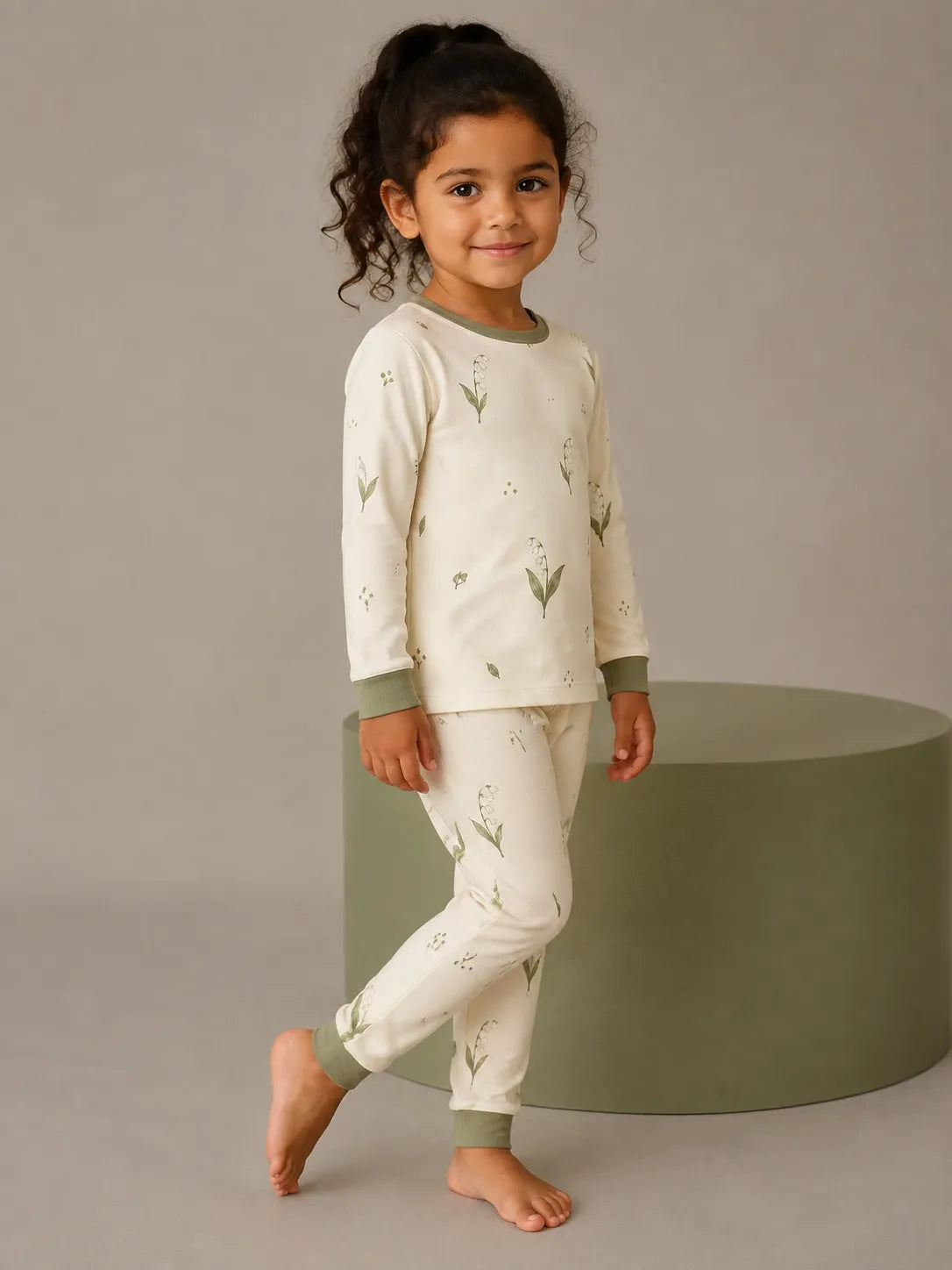 Child wearing the Little Botanicals long sleeve pajama set