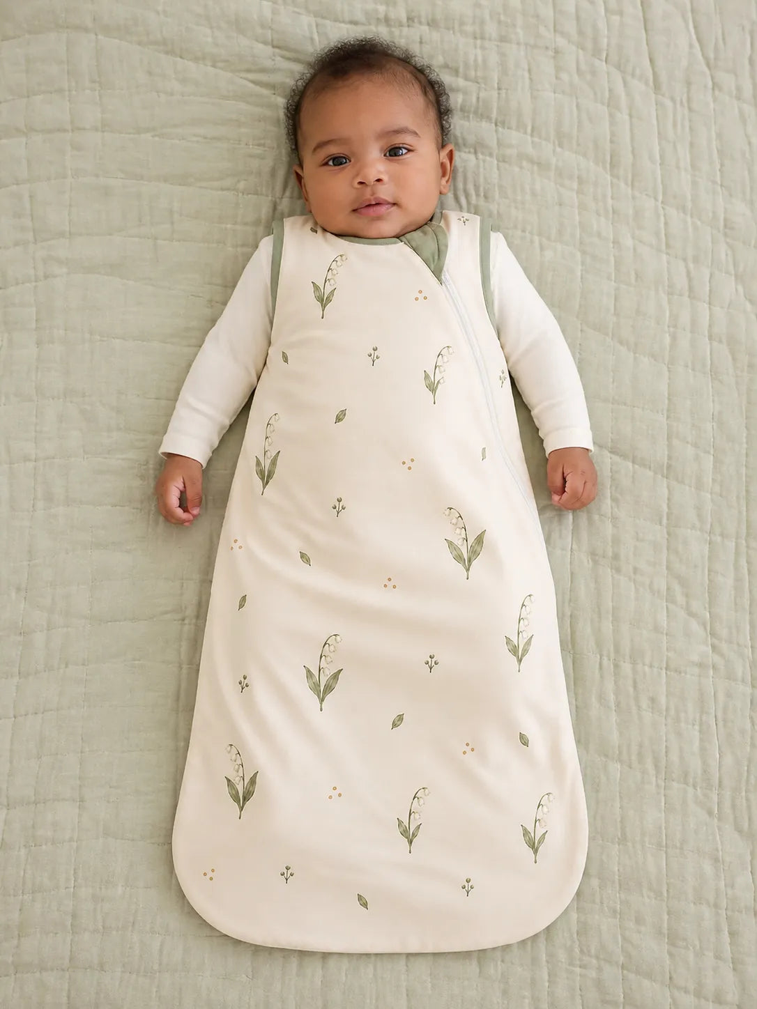 Baby wearing the Little Botanicals bamboo sleep bag