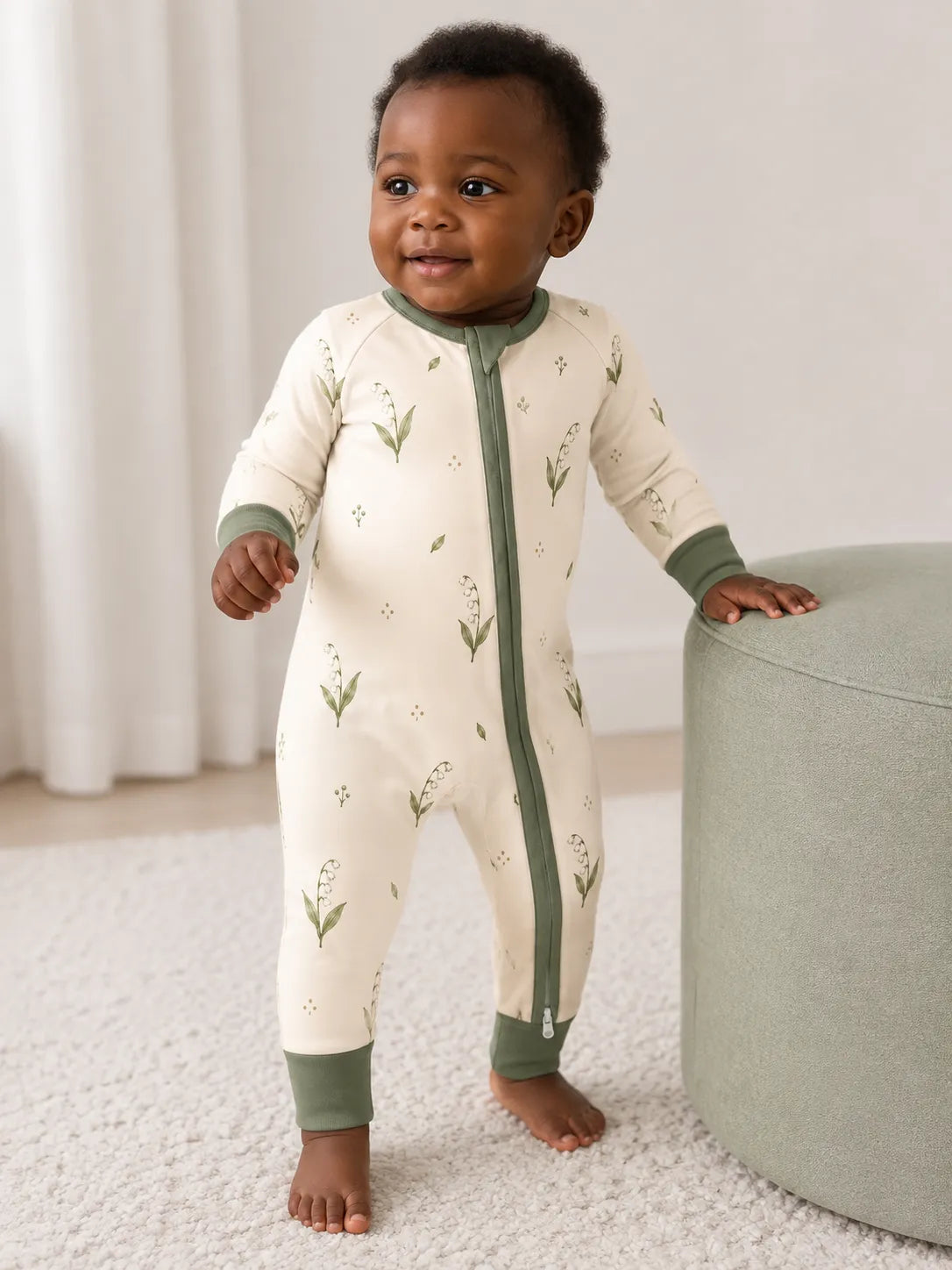 Baby wearing the Little Botanicals bamboo zipper romper