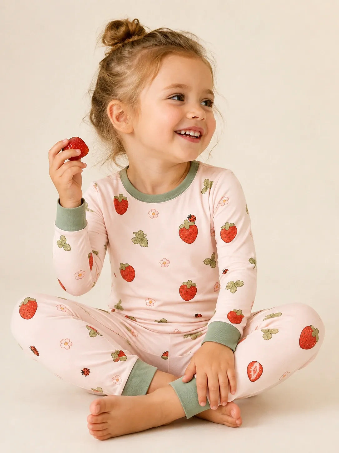 Child wearing the Strawberry Fields long sleeve pajama set