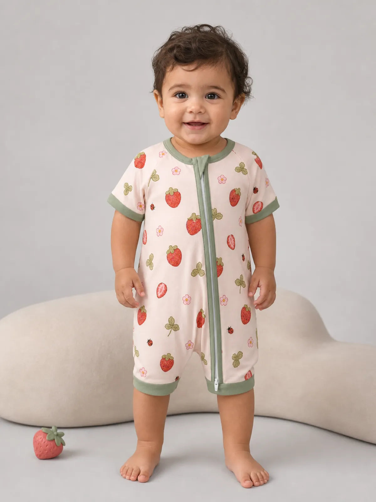 Baby wearing the Strawberry Fields bamboo shorty romper