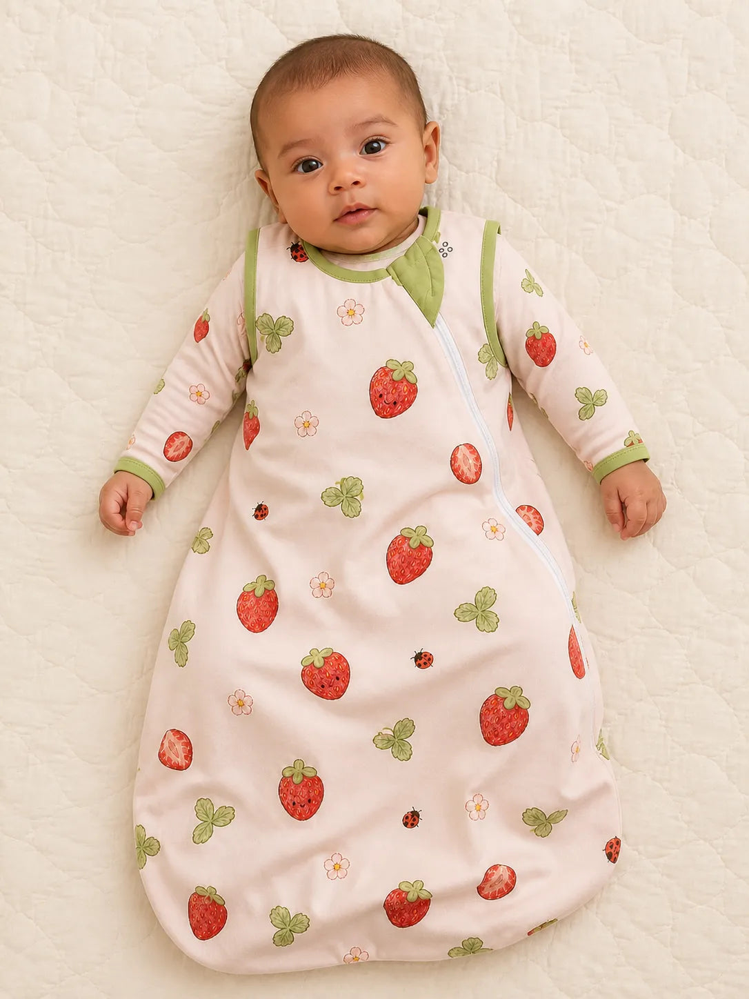 Baby wearing the Strawberry Fields bamboo sleep bag