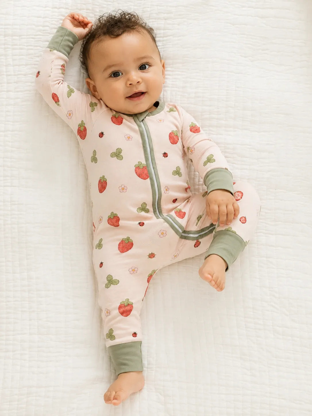 Baby wearing the Strawberry Fields bamboo zipper romper